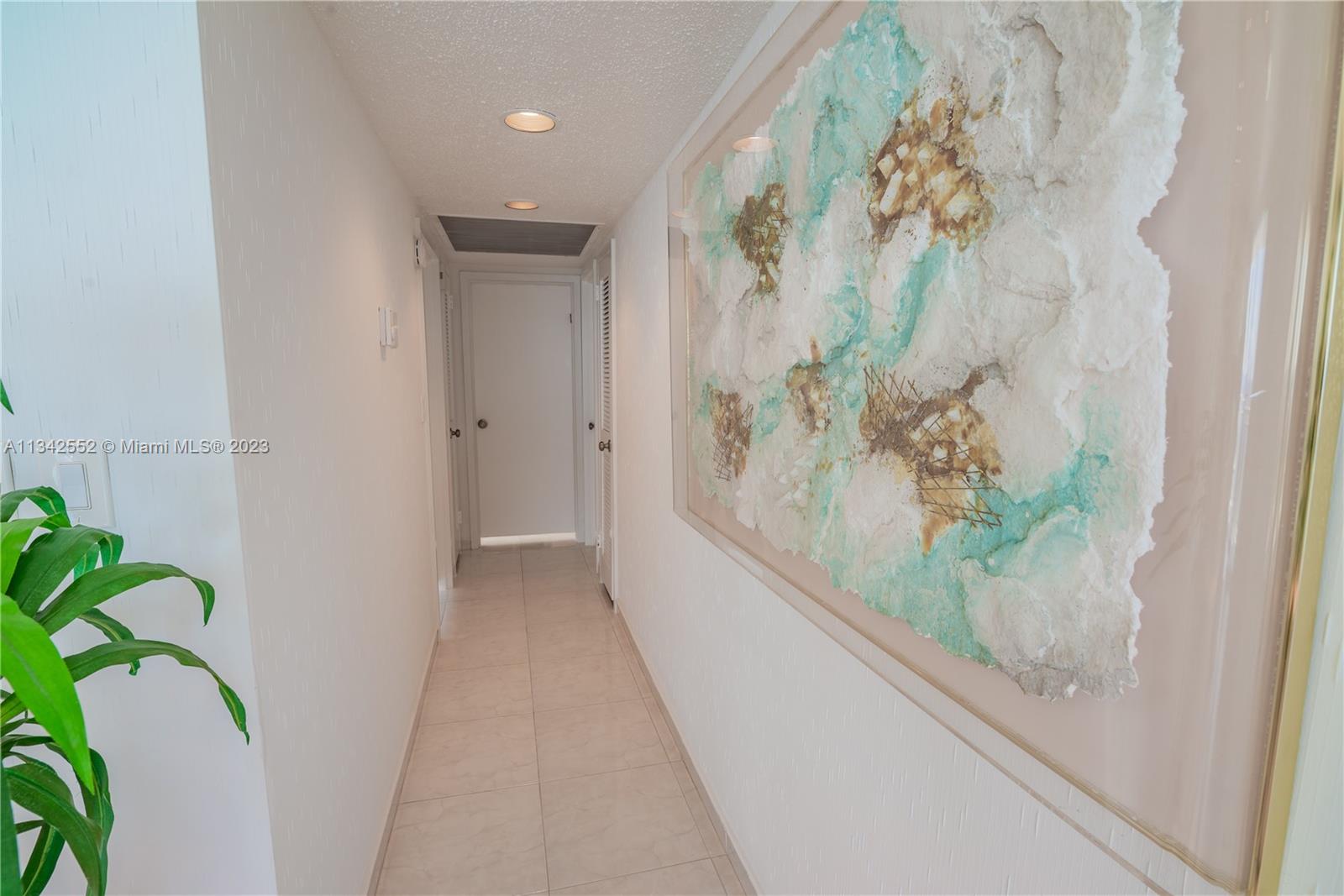 INTERIOR HALLWAY TOWARDS BEDROOMS