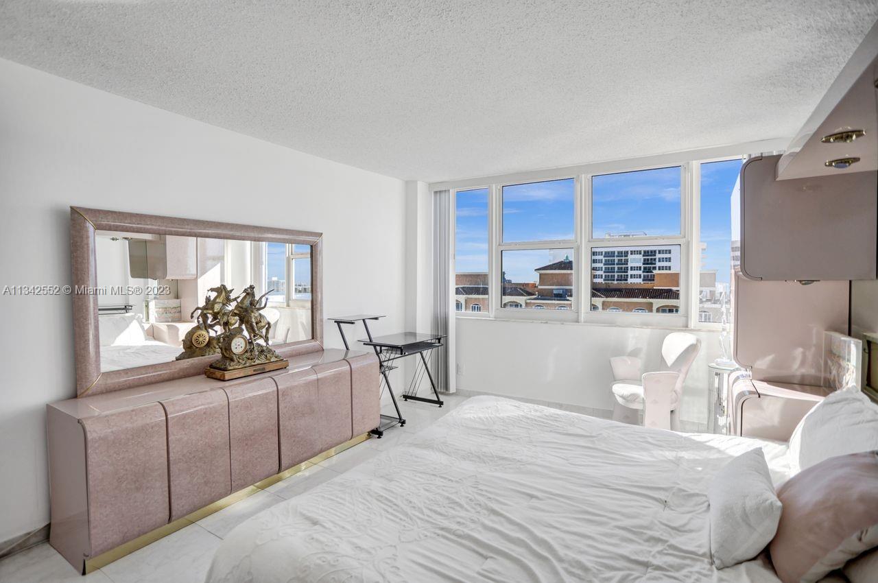 MASTER BEDROOM WITH WIDE WALL-TO-WALL OCEAN AND ICW VIEWS