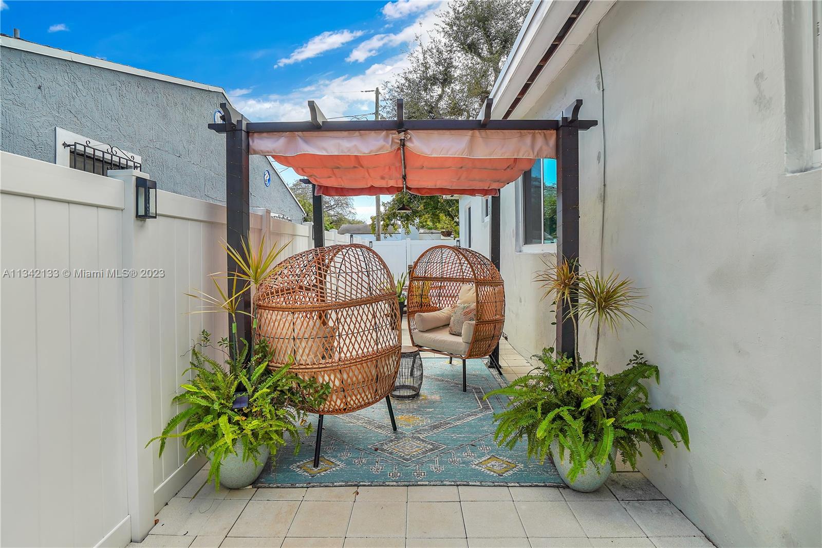 Lovely sitting area located on the side of the home