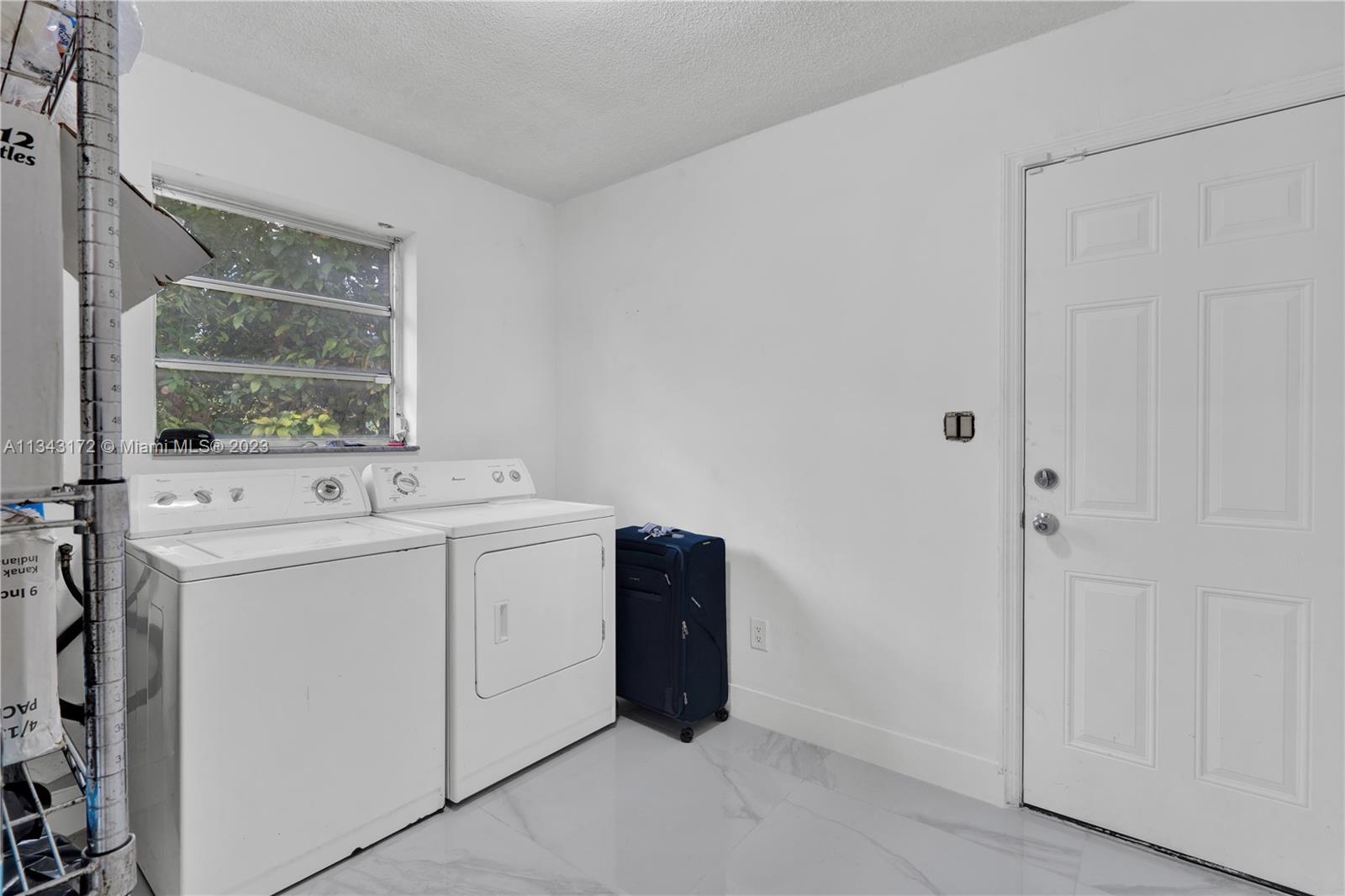 Separate Laundry Room adjacent to Garage