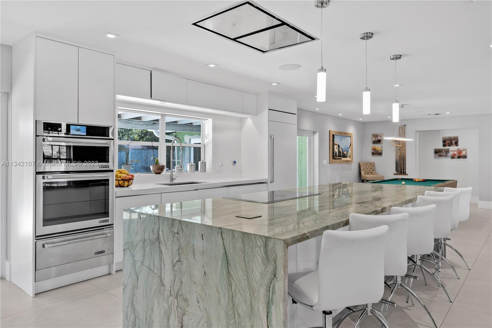 Welcome to this stunning fully remodeled 3 bedroom, 3 bathroom pool home, nestled on a sprawling 17,000 Sq.Ft. lot. As you enter the home, you'll be greeted by a warm and inviting open-concept floor plan, perfect for entertaining and daily living. The gourmet kitchen boasts brand new panel Jenn-Air Appliances, beautiful countertops, and ample cabinetry for storage. The kitchen opens up to the spacious living room, creating the perfect atmosphere for relaxation and comfort. The home features three generously sized bedrooms. All updated bathrooms. The backyard space transports you to your own private paradise. The expansive 17,000 sq. ft. lot offers ample space for outdoor living and entertaining.Take a dip in the crystal-clear pool, or host a BBQ on the patio. Truly a turn key property