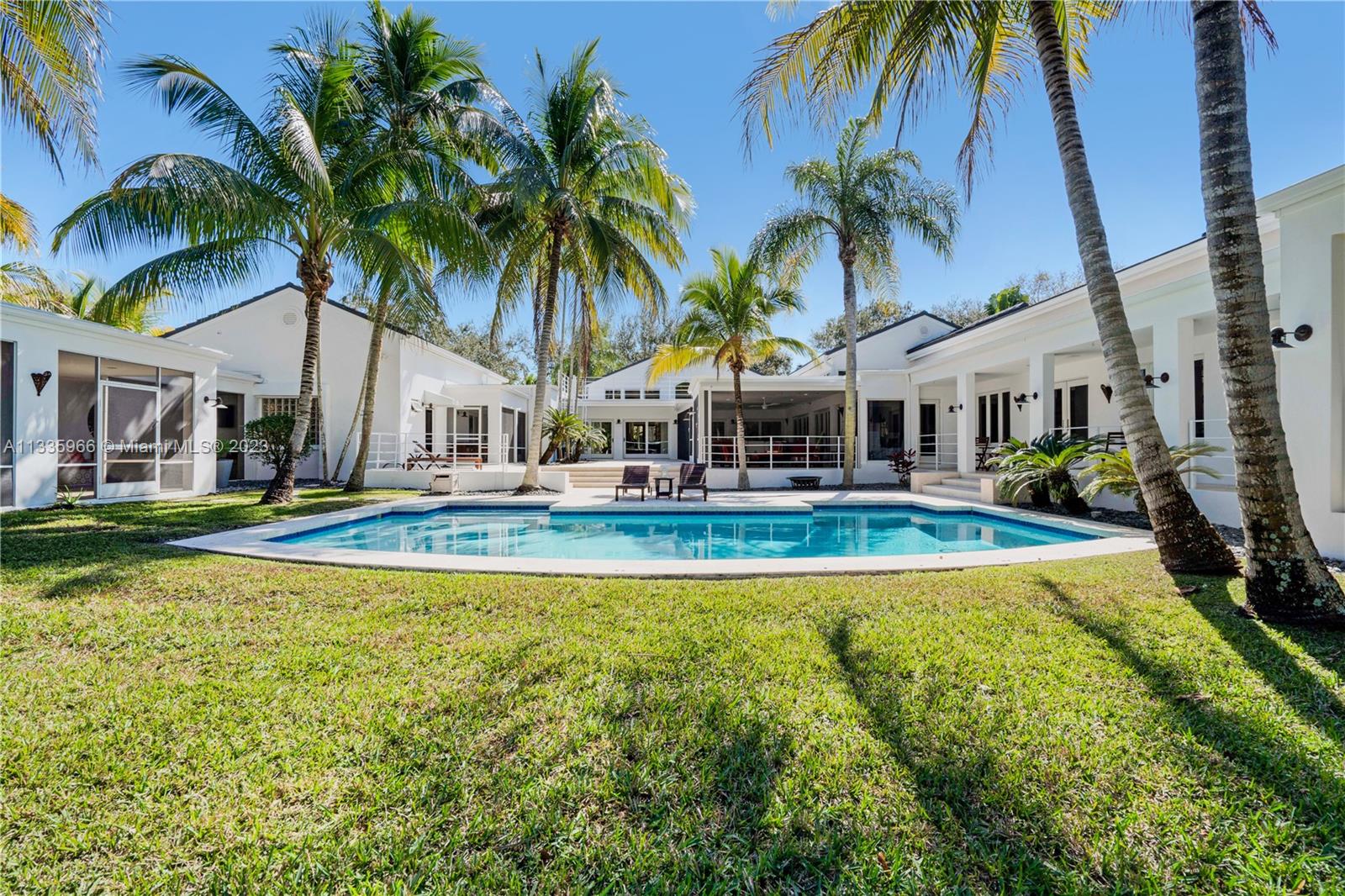 This immaculate contemporary resort-style home sits on a deep acre lot in the heart of Pinecrest. It is located in a low traffic street and was completely remodeled and updated by renowned architect David Johnson.
One of Pinecrest's few large one-story homes, it has 12ft high ceilings throughout most of the house.The 6 bedroom plus large and bright office space home is perfect for work and entertainment, with a full range of amenities including a professionally designed movie theater, a basketball court, a volleyball court, a dedicated ping pong area, a large pool, an oversized tree house and multiple outdoor sitting areas for alfresco living and dining.
A true family paradise!