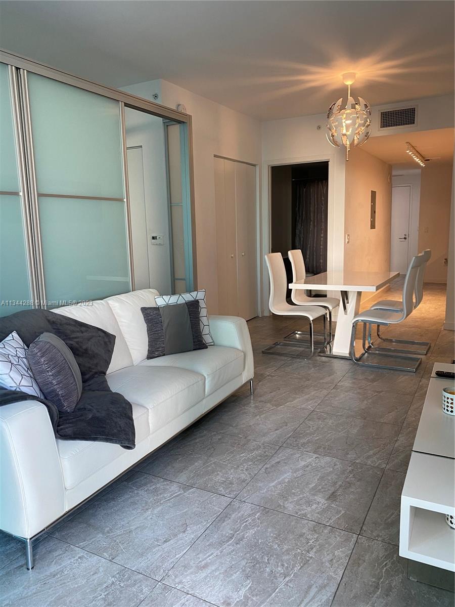 GORGEOUS FULLY FURNISHED STUDIO WITH BEDROOM AREA SEPARATED BY A BEAUTIFUL GLASS PARTITION. THIS AMAZING STUDIO IN THE HEART OF BRICKELL WAS TOTALY REMODELED WITH BEAUTIFUL IMPORTED PORCELAIN TILE FLOORS THROUGHOUT. THE SLIDING DOOR AND DIVISION SYSTEM INSTALLED SEPARATING THE BEDROOM FROM THE LIVING/DINING AREA CAN BE USED MULTIPLE WAYS. TOP OF THE LINE GOURMET KITCHEN WITH INTEGRATED REFRIGERATOR, DISHWASHER, WASHER AND DRYER. INCREDIBLE WEST CITY VIEWS WITH AMAZING SUNSETS AND CITY SKYLINE. WALKING DISTANCE TO RESTAURANTS, CAFE'S, SHOPS, BRICKELL CITY CENTRE AND MUCH MORE! INTERNET INCLUDED! AMAZING CONDOMINIUM WITH ROOFTOOP POOL, RESIDENTS LOUNGE, CLUB ROOM, KIDS ROOM, THEATER, GYM & SAUNA. JUST LIKE A CLUB! THIS UNIT WILL GO FAST. YEARLY OR SHORT TERM MIN 3O DAYS.