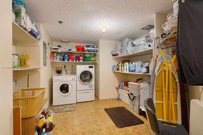 Liberal sized exterior storage and laundry room with A/C.