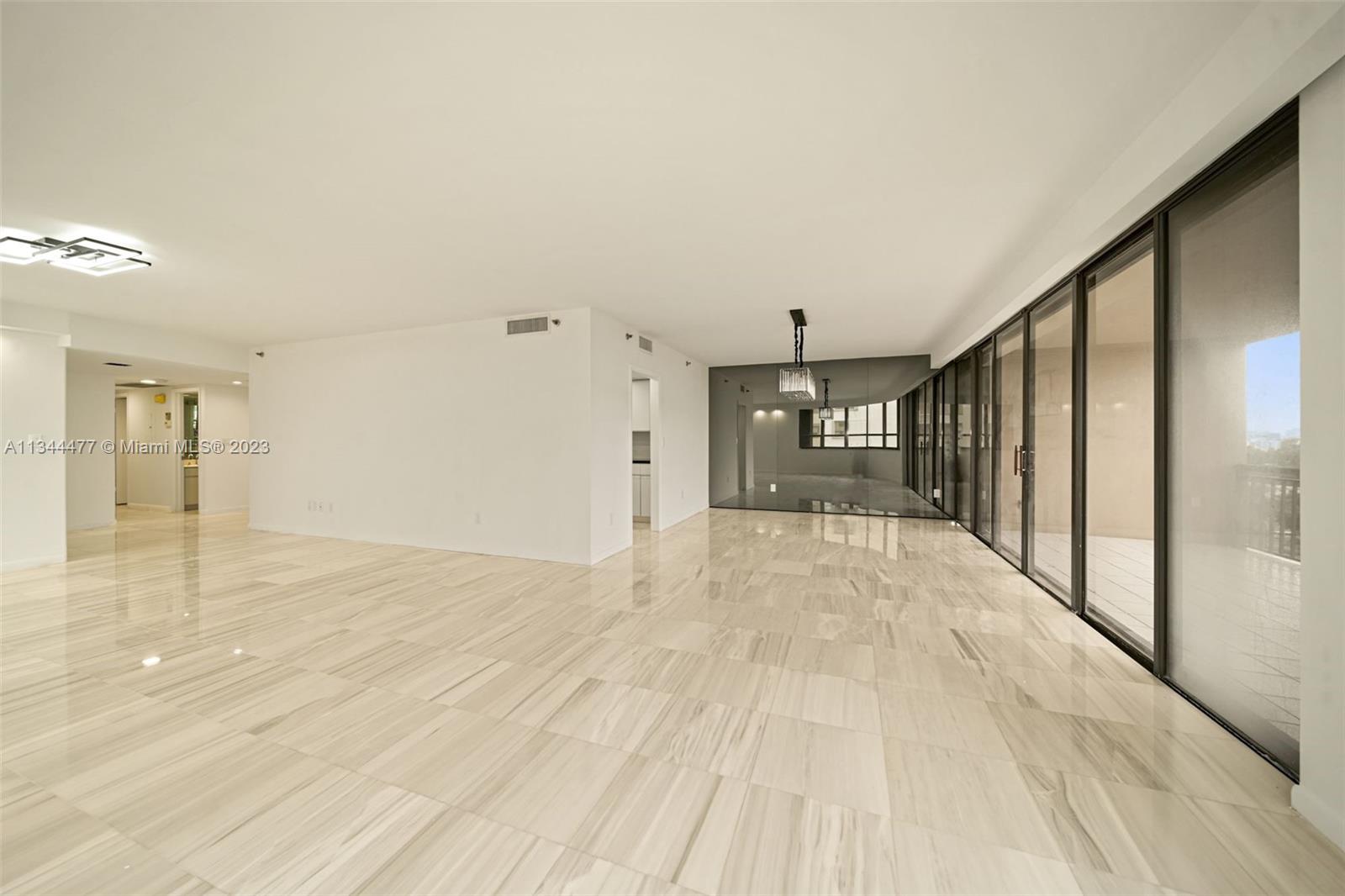 L Shaped Living and Dining Room overlooking Biscayne Bay