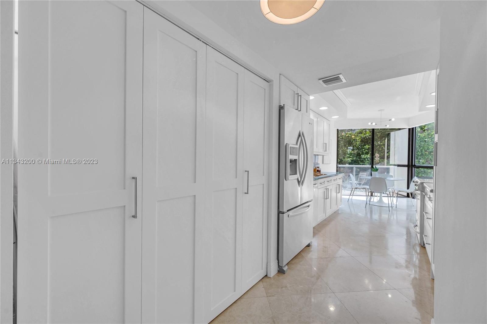 View of kitchen from entry by foyer