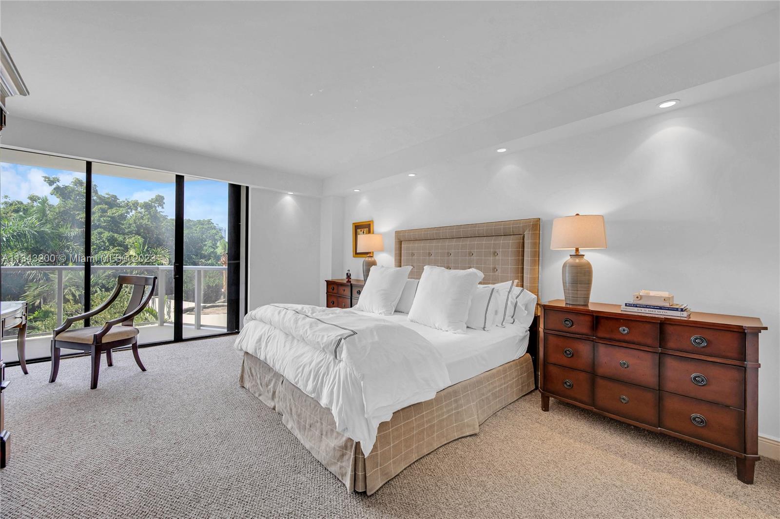 Spacious master bedroom with access to balcony