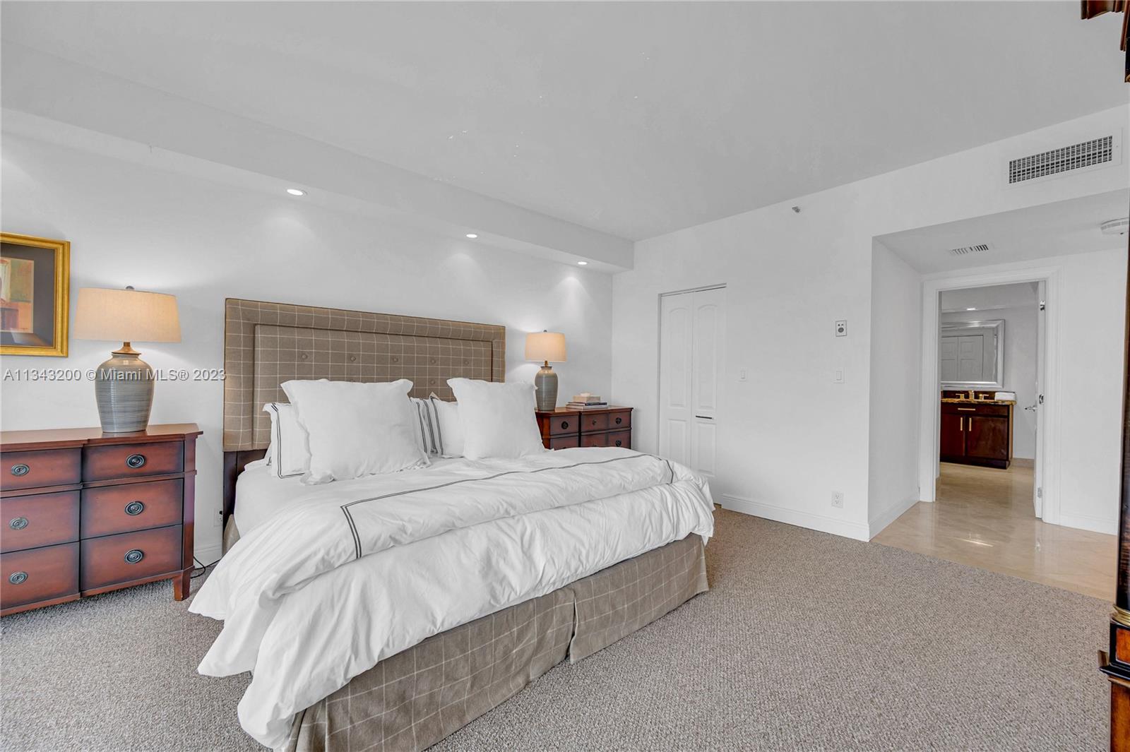 Spacious master bedroom with brand new carpeting and ample closet space