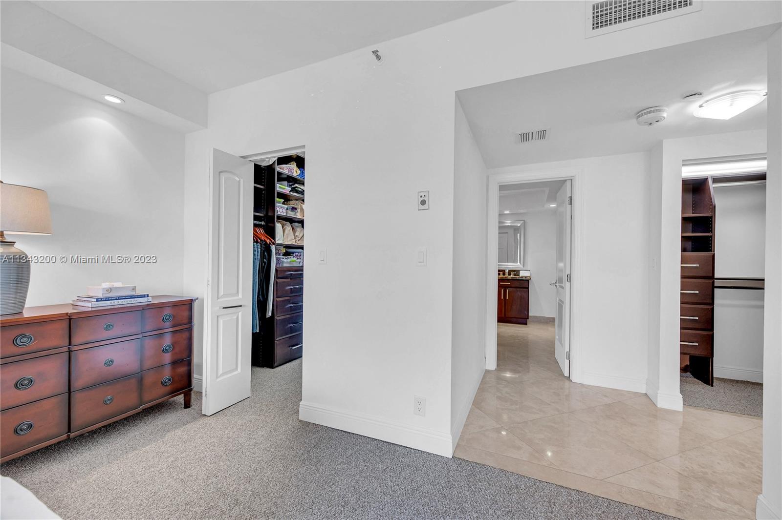 Master bedroom boasts a generous walk-in closet and an additional large closet, both with nice built-ins for storage