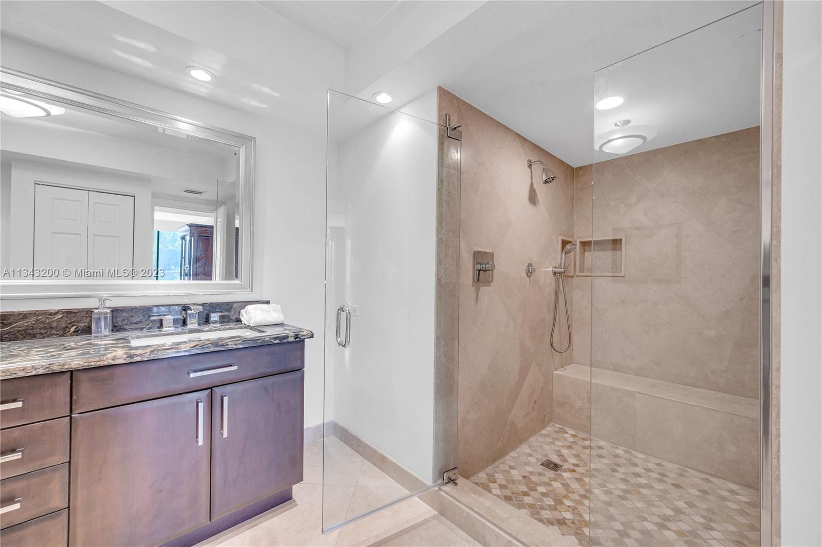 Master bathroom spacious shower with bench