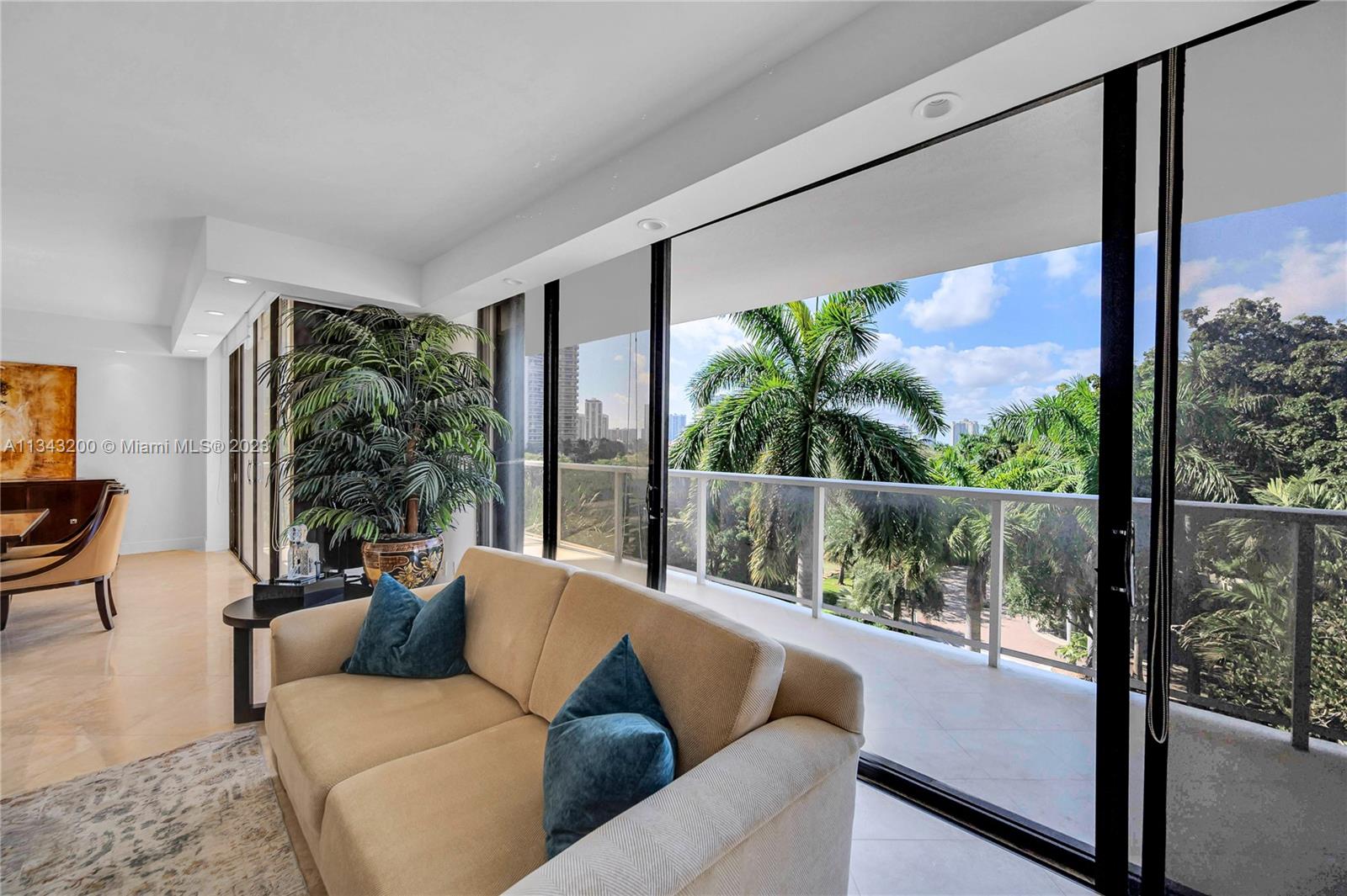 Living room views with expansive balcony in the background