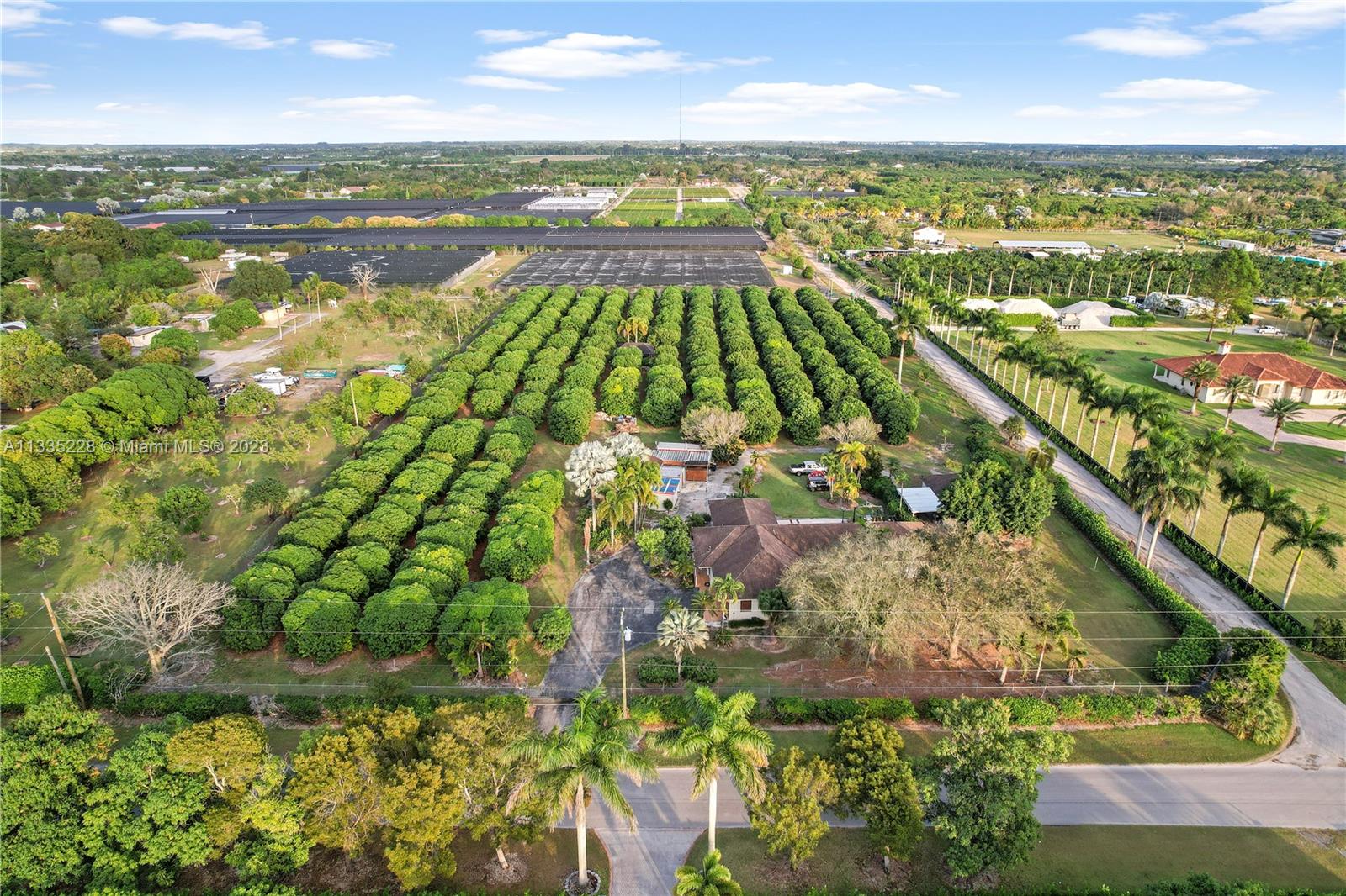 STUNING 5 ACRE INCOME RANCH WITH REMOLDED 3/3 MAIN HOUSE WITH A DETACHED 2 BED /2 GUEST GUEST HOME ON  A LUSH LYCHEE GROVE WITH ASSORTED OTHER FRUIT, APPROX 250 TREES..INCLUDED IN THE SALE IS A FULLY LOADED EQUIPMENT SHED AND TOOL SHOP, TRACTORS, EXCAVATORS ETC.. GOOD STUFF.... BOTH HOMES ARE IN TURN KEY CONDITION WITH OPEN FLOOR PLANS. THE MAIN HOUSE HAS ALL NE APPLIANCES FLOORS, ETC.. SHES A SPLIT PLAN WITH 2  BEDROOMS THAT ARE SUITES.. MARBLE WITH GREAT LIGHTING THRUOUT.....LOCATED ON A PRIVATE CROSS STREET IN REDLAND LOCATED ON THE CORNER WITH ACCESS TO  REAR,..THIS IS A MUST SEE..