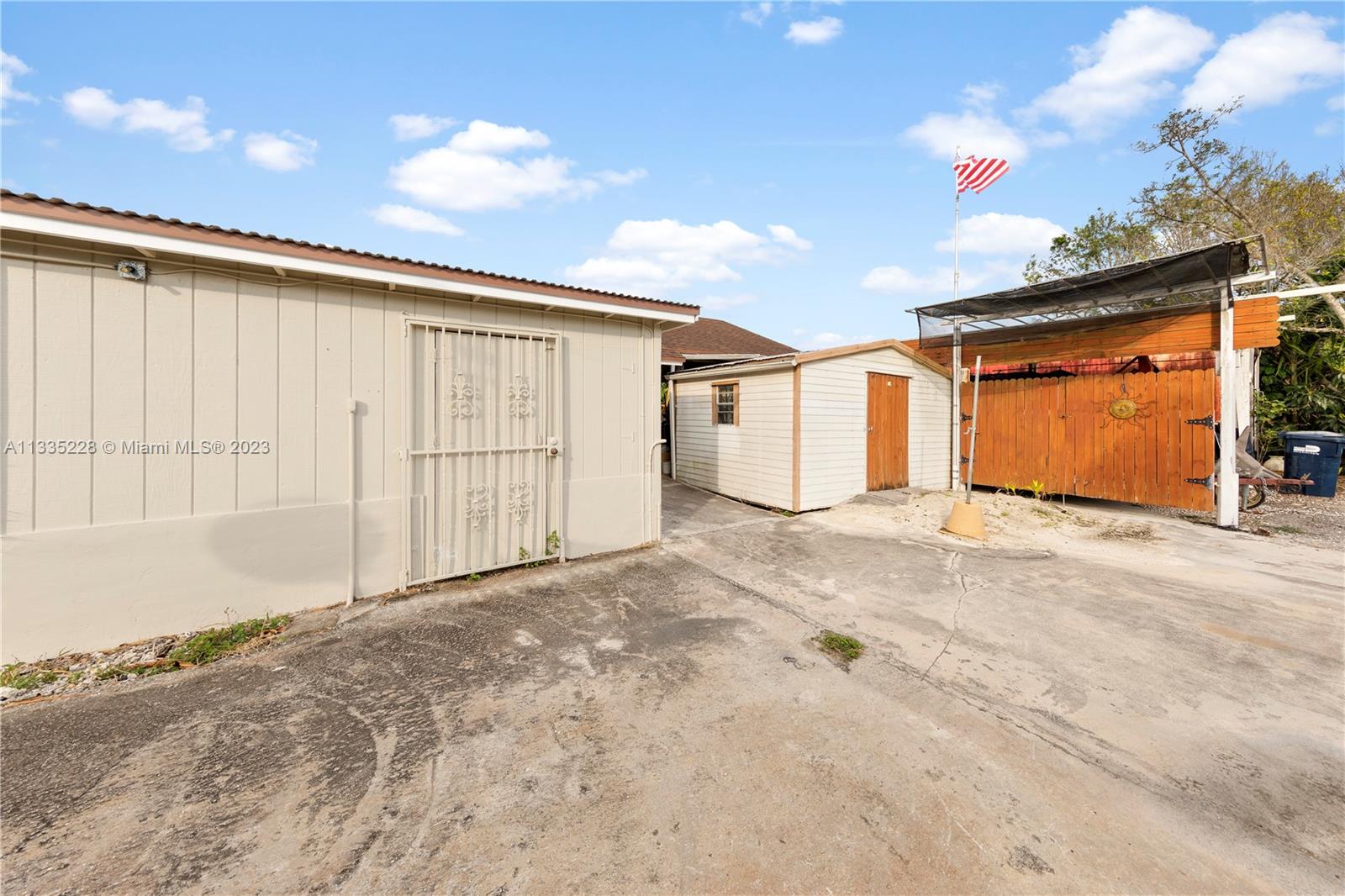 EQUIPMENT SHEDS W BARN IN REAR