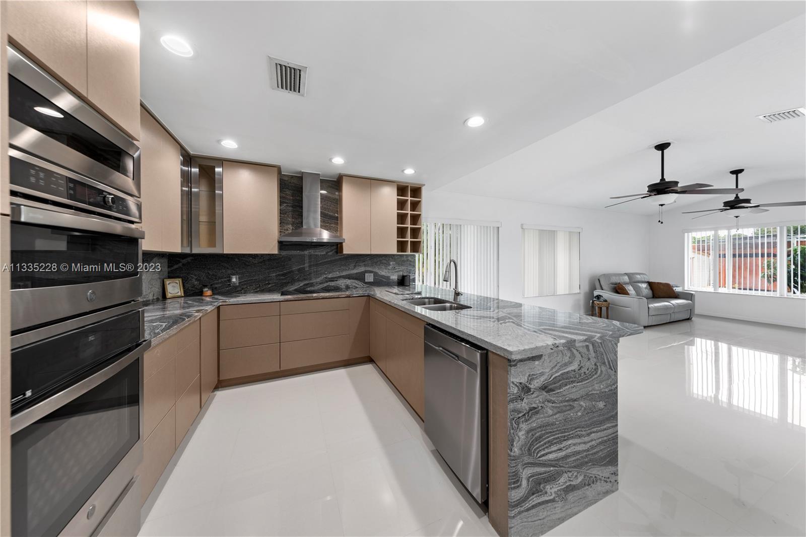 KITCHEN OPENS TO FAMILY ROOM