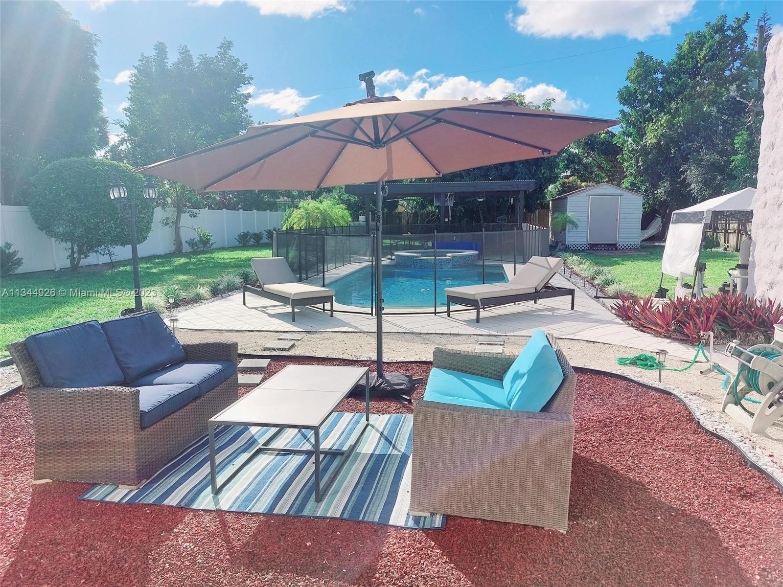 Amazing Spanish Style Fully Updated 3/2 Home + 1/1 Cottage Home on a Huge Lot of 15,000 SF with Delicious Mango and Avocado Trees. Beautiful Pool w/ Jacuzzi. Big Gazebo with Fans, TV and BBQ. 20x10 FT Shed. Updated Kitchen with Granite Countertops, Island, Dishwasher and Stainless Steel Appliances. Plenty of Closet space with Full Interiors. Hurricane Shutters. Monitoring cameras System. Centrally Located only 5 blocks away from Nightlife and Entertaining in Downtown Hollywood, and 2 Miles away from the Beaches. Watch Virtual Tour. By Apptm Only with Proof of Funds or Pre-Approved Letter if Financed. Priced to Sell! Call LA for Questions.