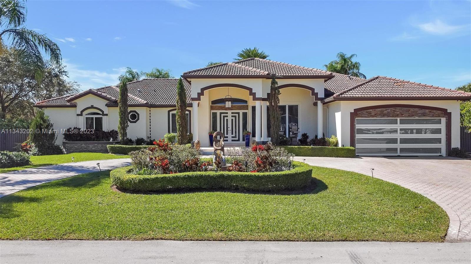 Totally Renovated Executive Home on 1/2 acre corner lot. Large backyard perfect for entertaining or enjoy a relaxing evening. Heated oversized pool, lush landscaping, covered terrace, Tiki, privacy hedges and fence. LED lighting with down lights. Large wrap around deck with bar. High ceilings with porcelain floors and wood floors in bedrooms. Spacious Primary suite with 2 walk in closets, large bathroom w/dble sinks, bidet, separate tub and shower. Kitchen opens to family room and breakfast area overlooking patio and pool. Interior Laundry. Air-conditioned  2 car garage with insulated custom Garage door. Emergency LP GAS Power portable generator and electrical panel. All Impact windows/ doors. City water/ sewer connected. Move In condition, many extras! A Must See!  Larger than tax roll