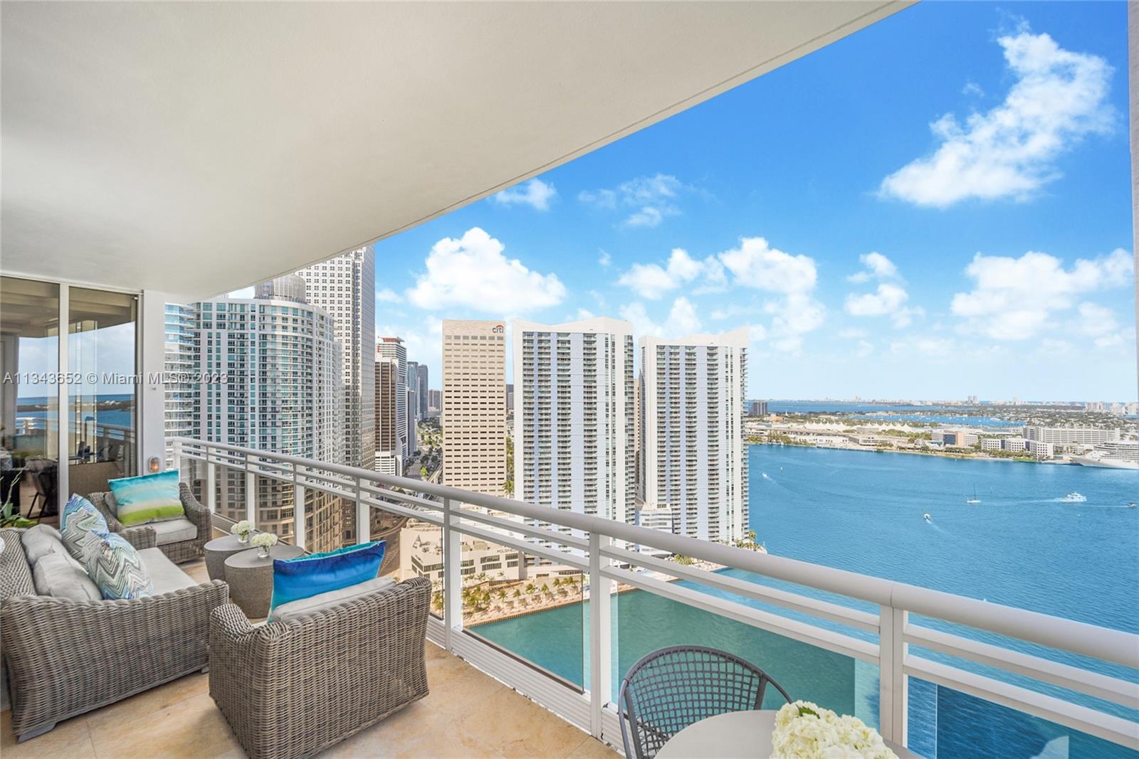 Breathtaking direct water&skyline panoramic views from every angle of this NE CORNER unit w/completely upgraded&sophisticated finishes perched up in the sky.This TURNKEY 4 bed/4.5 bath MODERN residence features soaring high ceilings, spacious layout w/wraparound terraces, high end technology w/ surround sound system installed in custom design ceiling & floating bar. Remodeled kitchen w/ breakfast nook design, subzero refrigerator w/ matching wine cooler,custom wooden & pocket doors, upgraded finishes in all bathrooms, newly designed walk- in closets in every room to maximize all sq. ft & full laundry room. Unique opportunity to own this ONE&ONLY condo in a BOUTIQUE building in a private island oasis.Amenities: lap pool,jacuzzi,sauna, 2 tennis courts,racquetball,gym,BBQ,&entertainment rooms