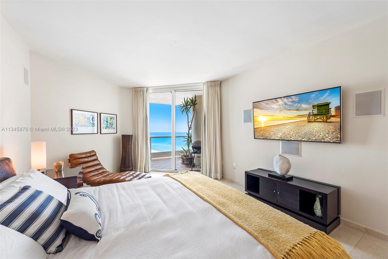 Bedroom ample enough to provide a seating area with view of ocean.