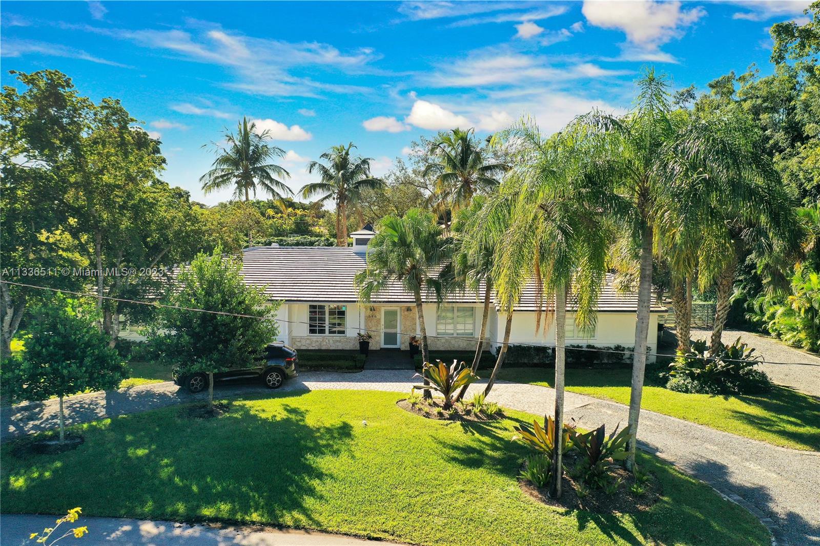 Lovely 4 bed, 3 bath house entirely remodeled in 2015, sits on a calm culdesac in walking distance from Fairchild Tropical Garden and Mattheson Hammock Park. Upon entering the home is spacious living room. The open space lets light pour in making the house bright yet cozy. Gather around a wood burning fireplace, an open bar and wine cellar in the large family. The floor plan separates the bedrooms from the rest of the house and the bonus room is a reflect guest area, that could be used as a gym or office. Also can be converted back into 2 garage space. The outside offers entertaining spaces around the pool and under the covered patio. The outdoor kitchen has it’s own bar to enjoy with friends and family. Minutes away from shopping or dining in the Grove, South Miami and Pinecrest.