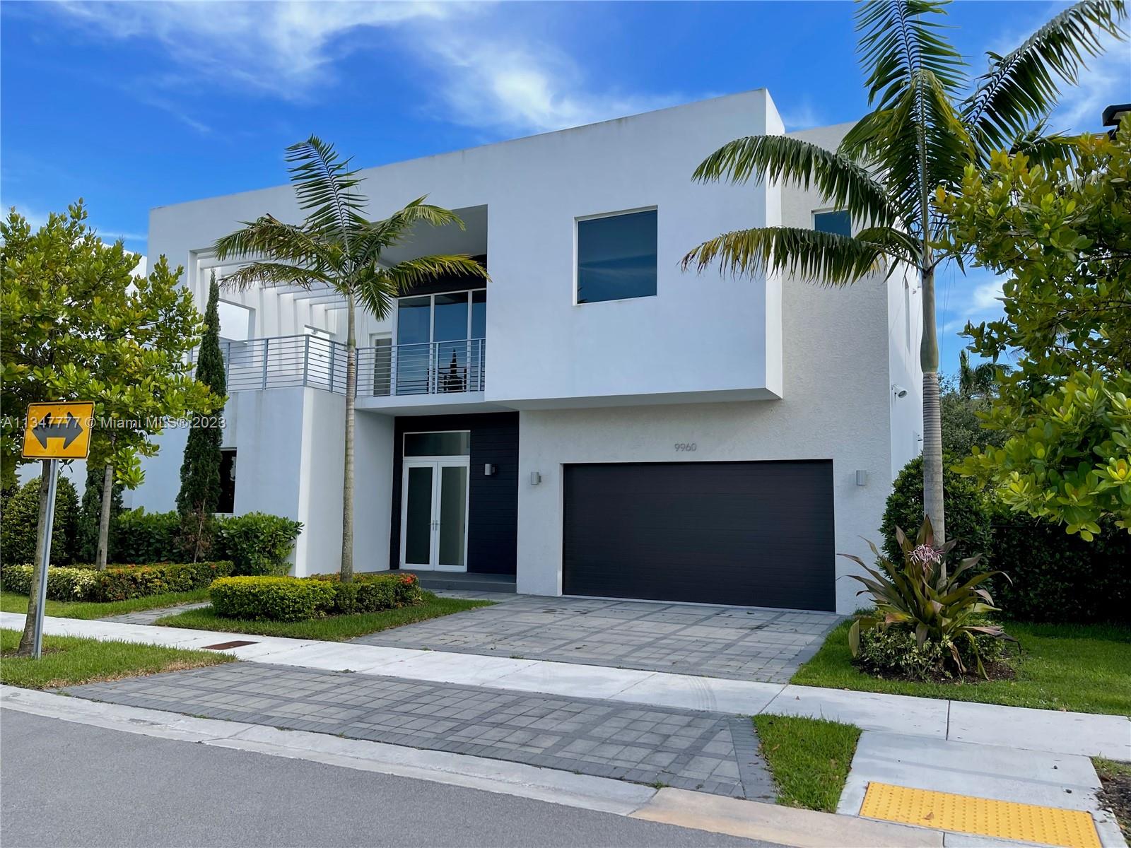 Exclusive home at Modern 60, the finest secure and gated community in the City of Doral. Five bedrooms and five baths two story house featuring an open floor plan on the first floor with elegant interior architectural details, 12' ceilings, impact windows & doors throughout, porcelain floors, kitchen with Italian cabinetry, quartz counter tops, top of the line SS appliances, smart home technology. Master bedroom features his and hers walking closet and a private balcony. Beautiful landscaping, private pool area with a summer kitchen excellent for entertaining. Enjoy private access to clubhouse w/state of the art amenities.