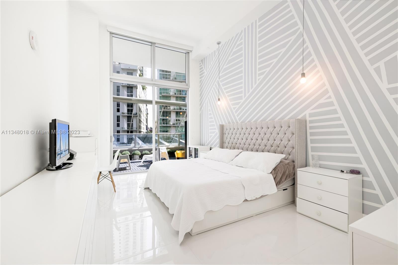 Incredibly spacious unit located at 1100 Residences designed by the famous Pininfarina. The unit has 2 Bedrooms & 2 Bathrooms + Den (which can easily be used as a nursery, playroom or an office). Unit features unique extra high 15'' Ceilings, Italian kitchen cabinetry, SS appliances, quartz countertops, laundry inside the unit and spacious updated bathrooms. 1 assigned Parking Space conventionally located at the same floor as the unit. The unit has an oversized terrace, ideal for entertainment! 1100 Residences offer luxury amenities, such as party rooms, 2 pools (including a rooftop pool), state of the art gym, kids' playroom, theater and much more. It is located in the most sought neighborhood in Miami: Brickell. Enjoy walking distance to restaurants, shops and metro stations.