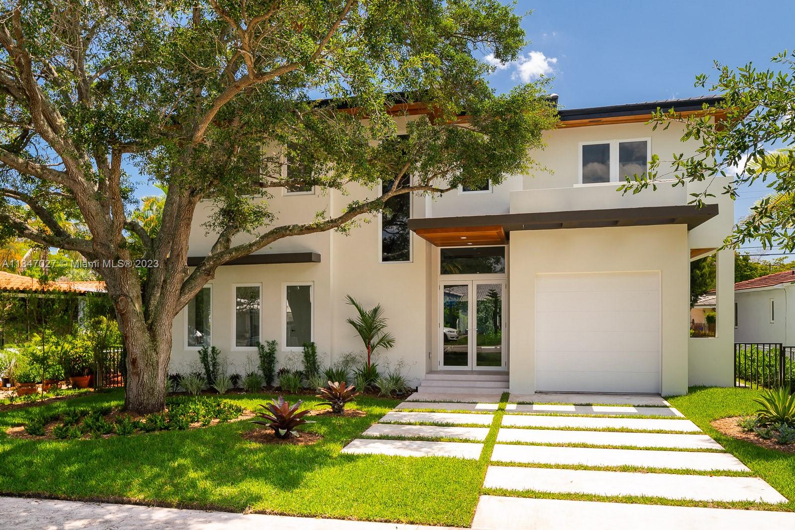 Indulge in luxury living at this magnificent 2-story residence in the highly-coveted Coral Gables. With 4 bedrooms and 4.5 bathrooms, the property is a testament to fine craftsmanship, blending both classic & modern styles in perfect harmony. The main level boasts open-concept social areas, complete with a modern Italian kitchen, showcasing a spectacular array of premium appliances. The upper floor features bedrooms with walk-in closets and a laundry room. Features such as high ceilings, eco-wood flooring, designer bathrooms with matte black fixtures, create a refined ambiance. Outside, the large pool & covered patio provide an ideal setting, whilst the fully-equipped summer kitchen is perfect for dining alfresco. Pre-installed internet & 1-car garage complete this luxurious haven.