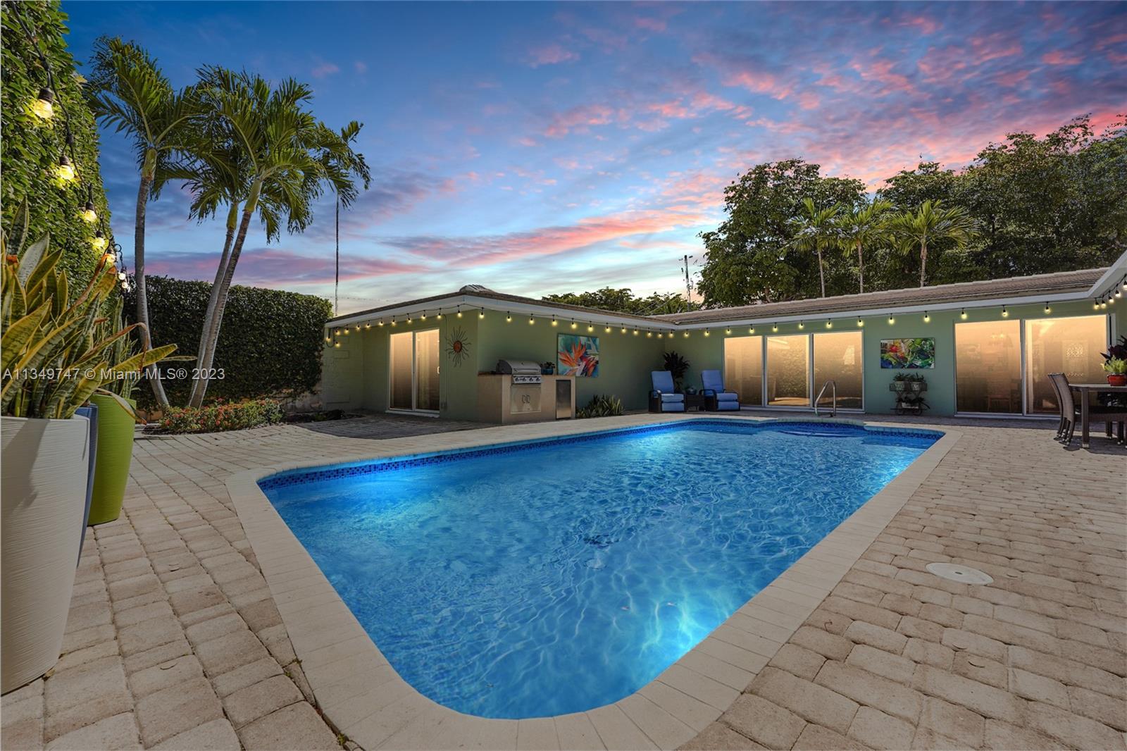 One of the MOST secluded areas of East Fort Lauderdale. This beautiful estate which boasts over 3674 sqft is located in the highly sought-after Sunrise Intracoastal gated community. A circular driveway with a separate entrance to the oversized garage make this the perfect corner home for families with multiple cars. The interior was professionally designed to a coastal-transitional vibe, with wrap around impact windows offering views of the centrally located heated saltwater pool. A perfect home for entertaining in an indoor-outdoor setting, with built in BBQ and refrigerator. Two great rooms, a central kitchen, office and 4 generous size bedrooms. The master bath even has a private  spa area. Surrounded by gorgeous landscaping gives the effect that you are living in a hidden oasis.