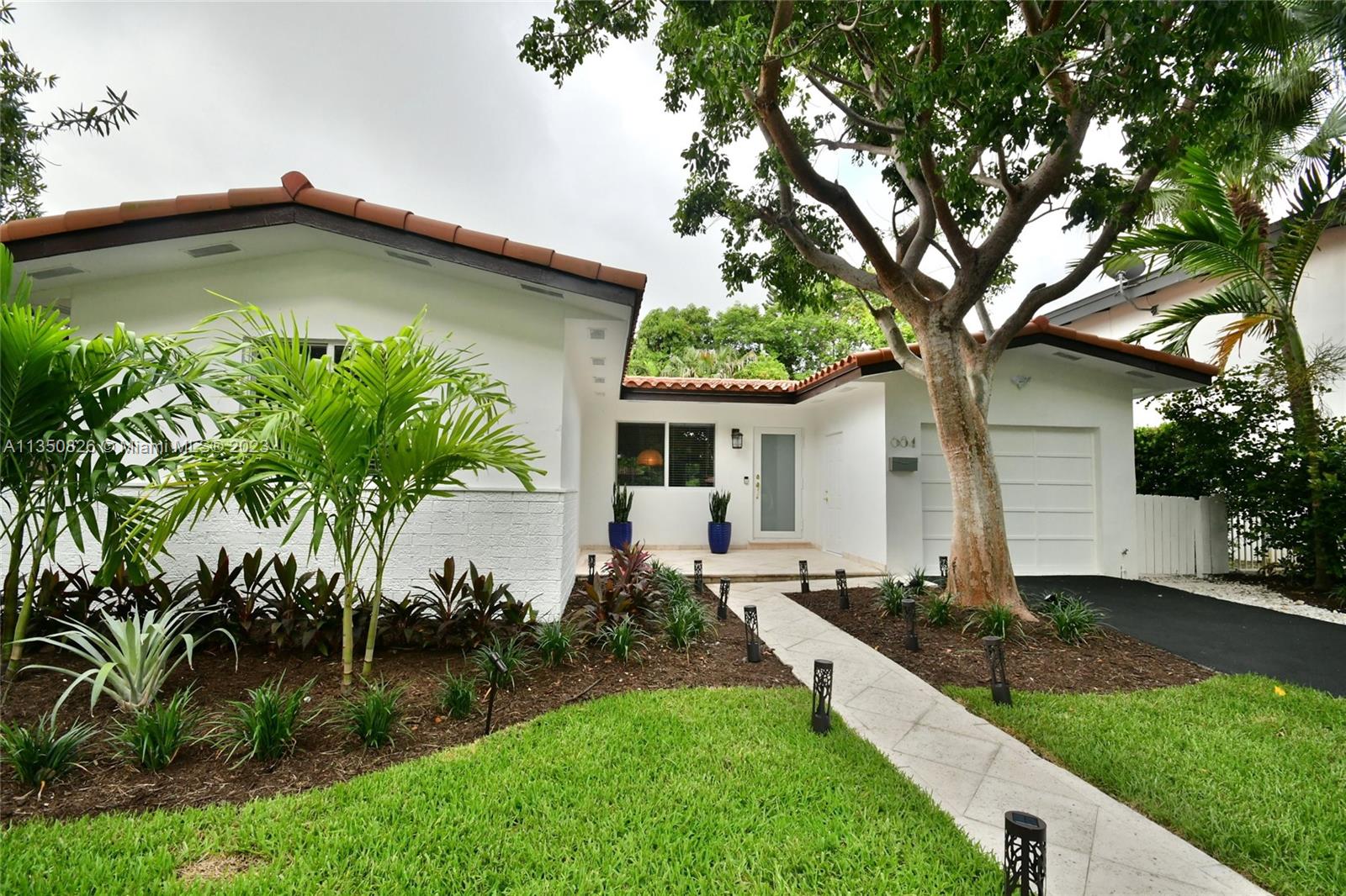 Priced to sell. Stunning renovated contemporary 3/2.5 home w/ beautiful high end finishes. Renovated baths and kitchen. New Roof March, 2019; New A/C March, 2017; Impact windows & doors; painted inside & out. Spacious open Living, Dining & Florida room w/marble flooring and flooded w/ natural light leading to the serene private backyard. Fabulous 200+ SQ FT Chef's Eat-In Kitchen w/ large windows, French door, stainless steel Island, double oven, custom cabinetry & imported Spanish porcelain flooring. Laundry room & half-bath adjacent to kitchen. Spa like Master bath w/ dual sinks, faucets & flooring from Italy & dual rain shower heads. Walk to Shops @ Merrick Park, Coral Gables library and Youth Center. Enjoy the tranquil neighborhood steps from the home for exercising and enjoying nature.