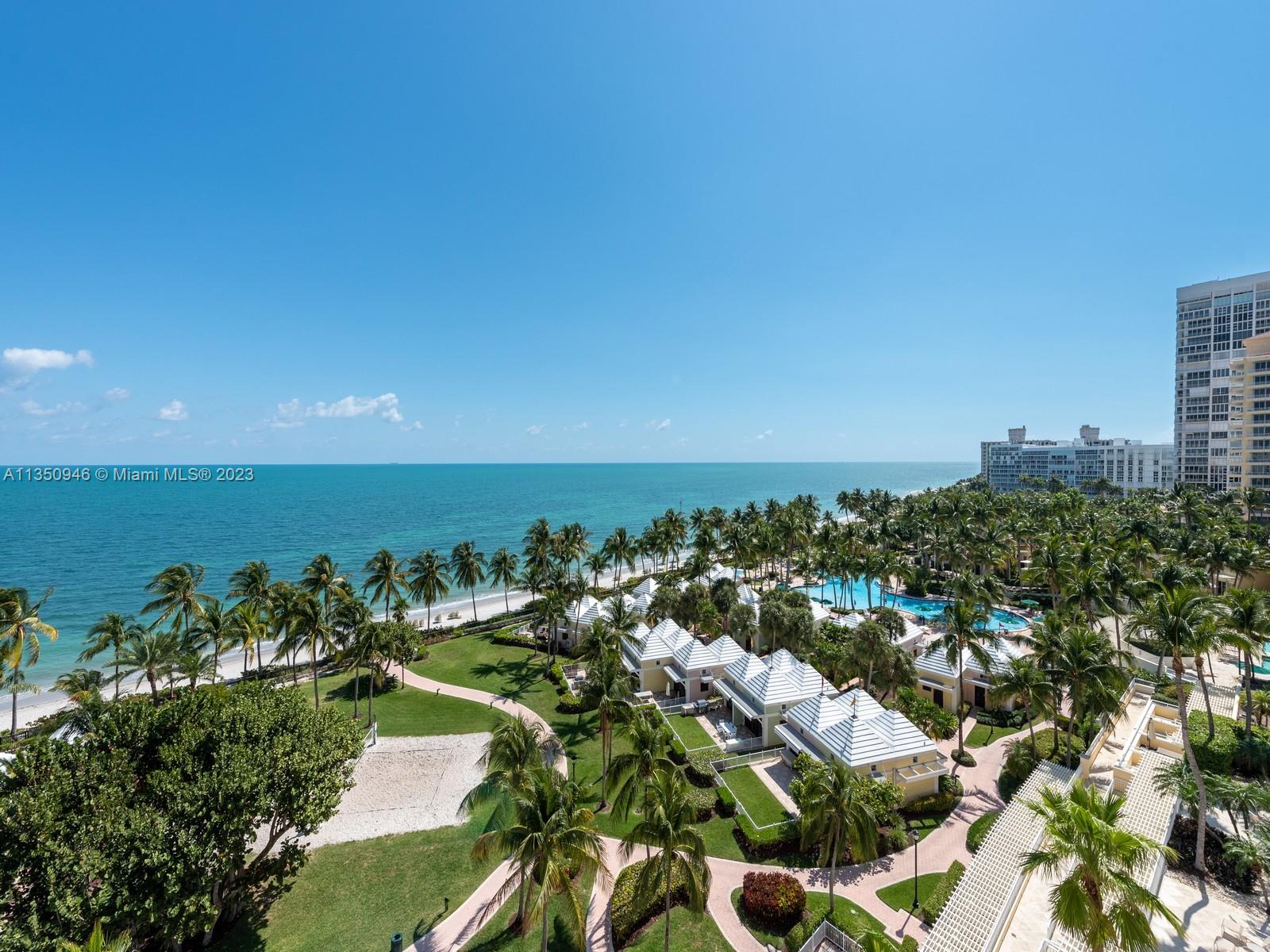 Beachfront house in the sky – The largest model apartment at Ocean Club **** 5,207 sq.ft. of luxurious space, was remodeled and redesigned by Adriana Hoyos in 2018.  Step out of your private elevator and enter your own grand foyer.  Be in awe with the panoramic views of sky and beach that surround you.  This 4 bedroom en-suite plus staff quarters, 5 bath plus powder room, plus
ocean facing office/den, and wrap around terraces, and four garage spaces (one is a tandem) is in a stack that has its own private concierge, fur storage room and its own wine cellar, all for your added convenience.  Ocean Club features three restaurants, Spa, round the clock security, and all amenities expected in a world class resort.  Easy to show.