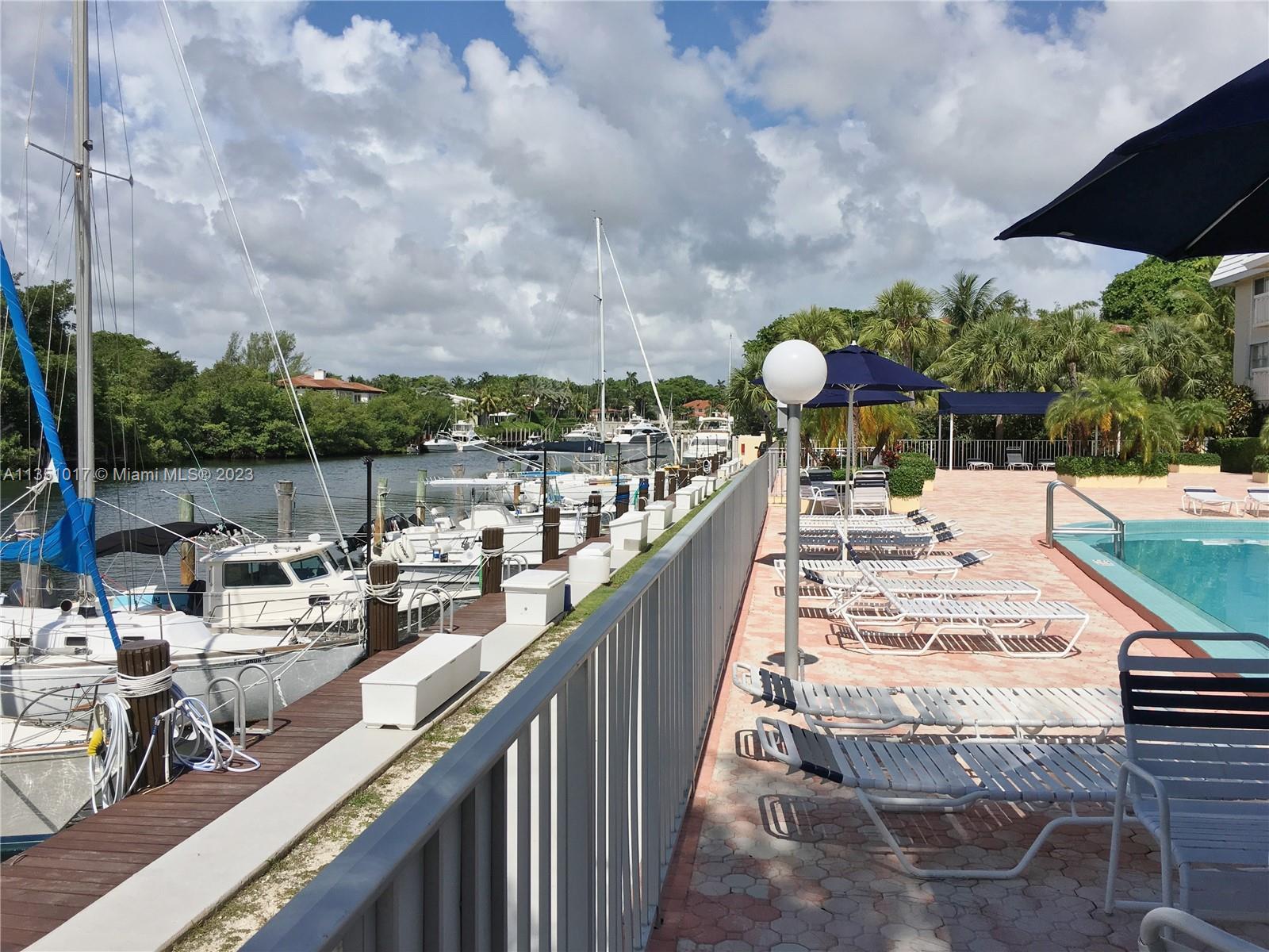 Completely updated water facing 1 bedroom + office nook / 1.5 bathroom residence. Unit looks out towards pool and the waterway. Waterfront building with no bridges to bay. No expense was spared on this condo. Hurricane impact windows, electric blinds, quartz countertops, SS appliances, wine cooler, porcelain wood flooring, standing shower with overhead waterfall and full size tub, heated towel racks, walk-in closet. Tranquil Edgewater Dr building with relaxing heated pool overlooking the waterway. Rent/Buy a boat slip, when available, and keep your boat at home. 1 assigned parking space + 1 storage cubby included with sale. 50 Year Recertification has been completed.