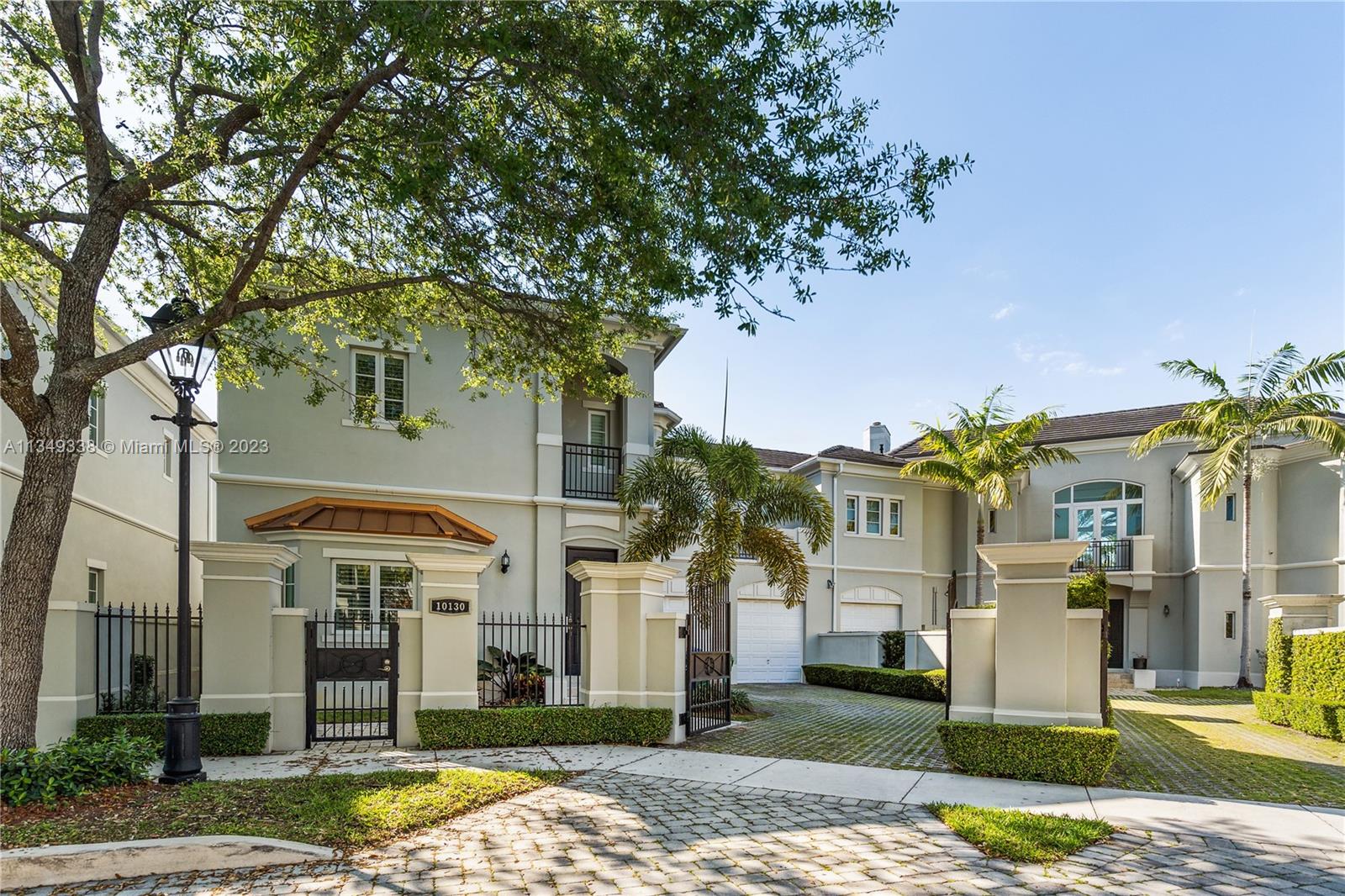 Unique opportunity to live in a community of only 12 houses situated on a cul-de-sac in North Pinecrest. The home has high ceilings throughout, all high-impact windows and doors, kitchen has Viking appliances including a gas range and beautiful wood cabinetry. Travertine floors on the main level, spacious master bedroom with 2 walking closets, dual sink, and separate tub and shower. Laundry room located on the second floor, central vacuum, and gated 2-car garage. Pinecrest School District, this house is a must-see it!