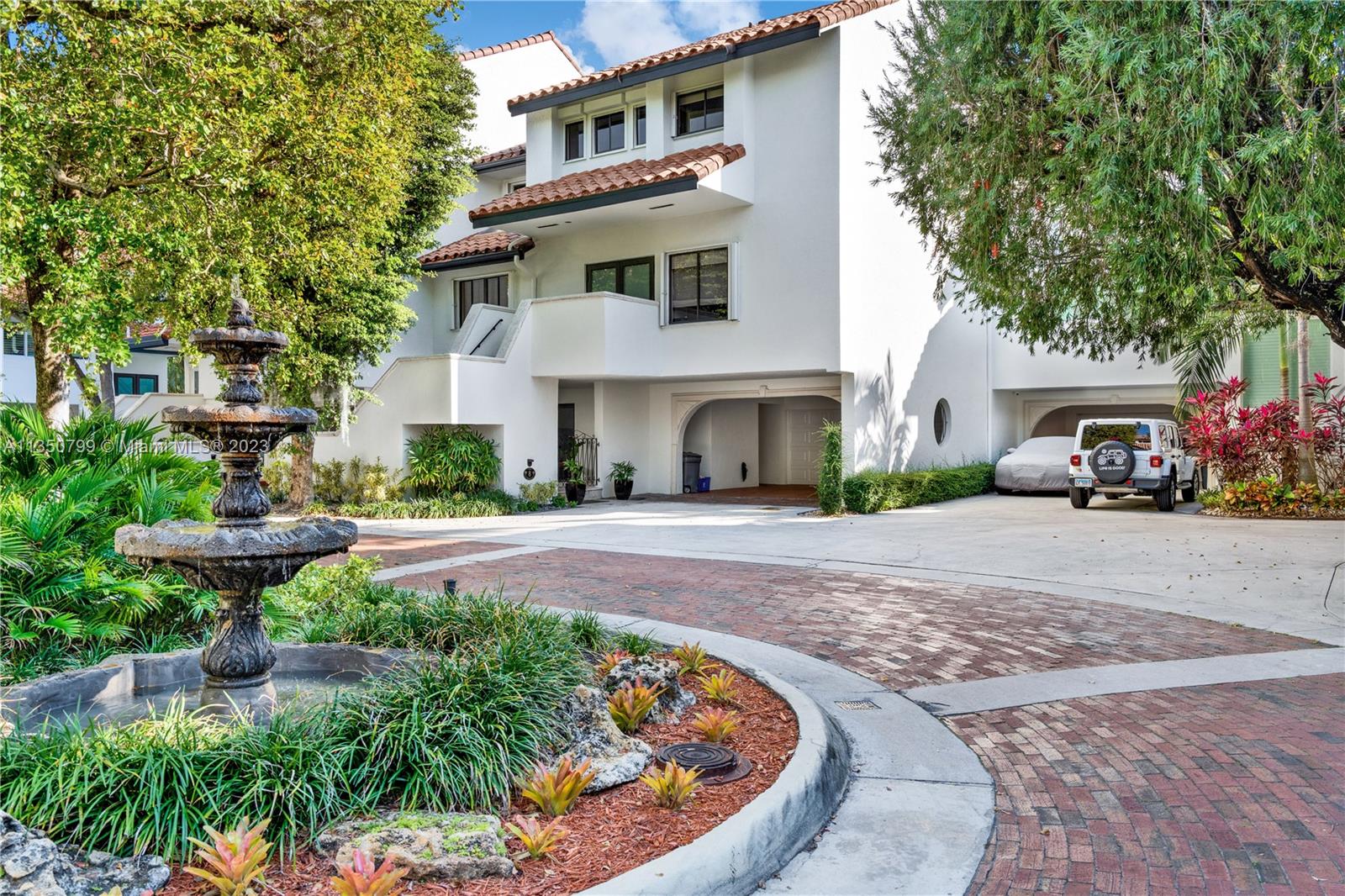 Beautifully updated townhouse in the private and guard gated community of l'Hermitage with direct access to Biscayne Bay.  Live in one of the best locations in Coconut Grove, minutes from I-95, Brickell, the village of Coconut Grove, Coral Gables and The design district.   Open concept modern kitchen with dining and expansive living area with volume ceilings overlooking the manicured gardens and beautiful waterscapes of l'Hermitage. Slide open your hurricane impact doors and walk out of your back porch to the swimming pool and the Bay Area.  This villa has two bedrooms on both the second and the third floor as well as a full guest / in law suite on the first floor. Huge master bedroom! Boat slip available separate from the sale. Walking distance to Kennedy Park and Regatta Harbor.