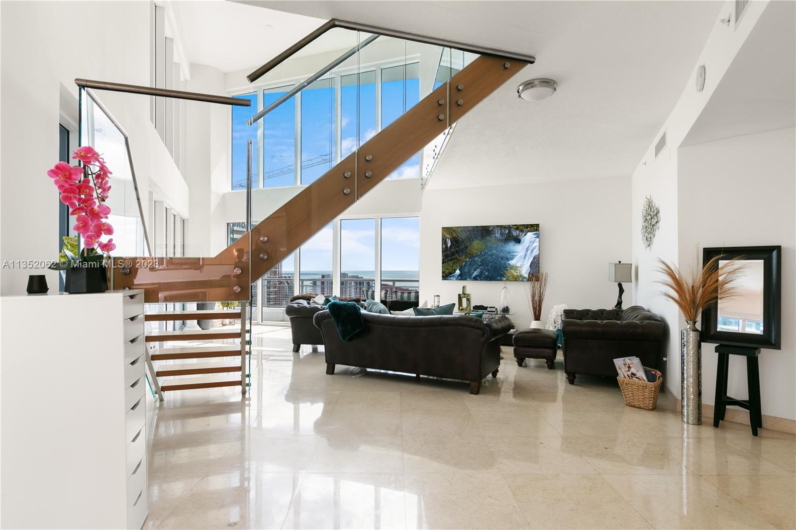 Infinity on Brickell offers a "Unique " and only unit with an exclusive MEZZANINE. which adds an additional 100 sq ft to the property. The 30th floor corner unit has a spectacular 180-degree view of Biscayne Bay, Key Biscayne, Fisher Island, Coconut Grove, Coral Gables, South Miami and the magnificent condo buildings on Brickell Avenue. Double height ceilings and floor to ceiling glass windows and a floating staircase.  On the second floor there are 2 bedrooms with full bathrooms. 
The third bedroom with a full bathroom is on the first floor. All rooms are bright, spacious and have their own balcony to admire the breathtaking view from Biscayne Bay! Offers a guest half bathroom.
Please see Brokers Remarks for additional information.