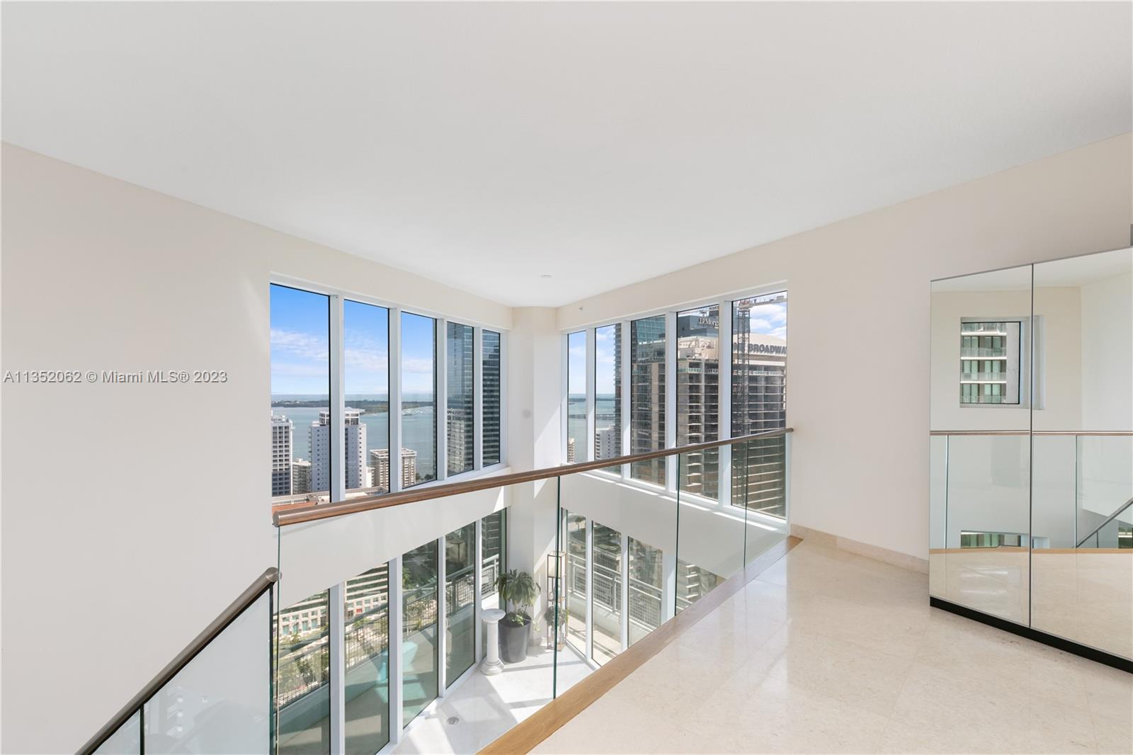 Living room and Floating staircase with a magnificent Bay view and Brickell