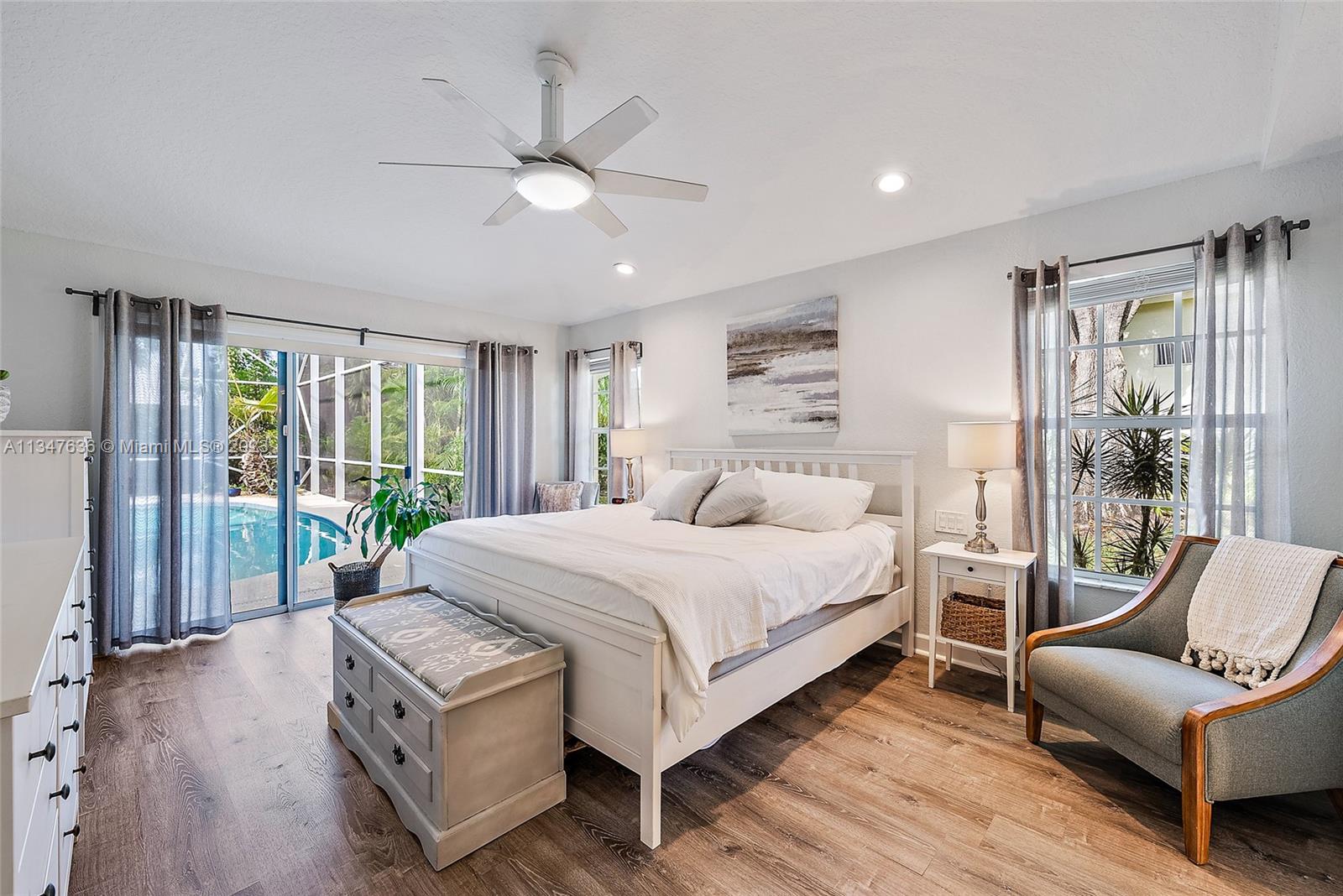 Kitchen and Family room with sliding doors out to patio/lanai/ pool.