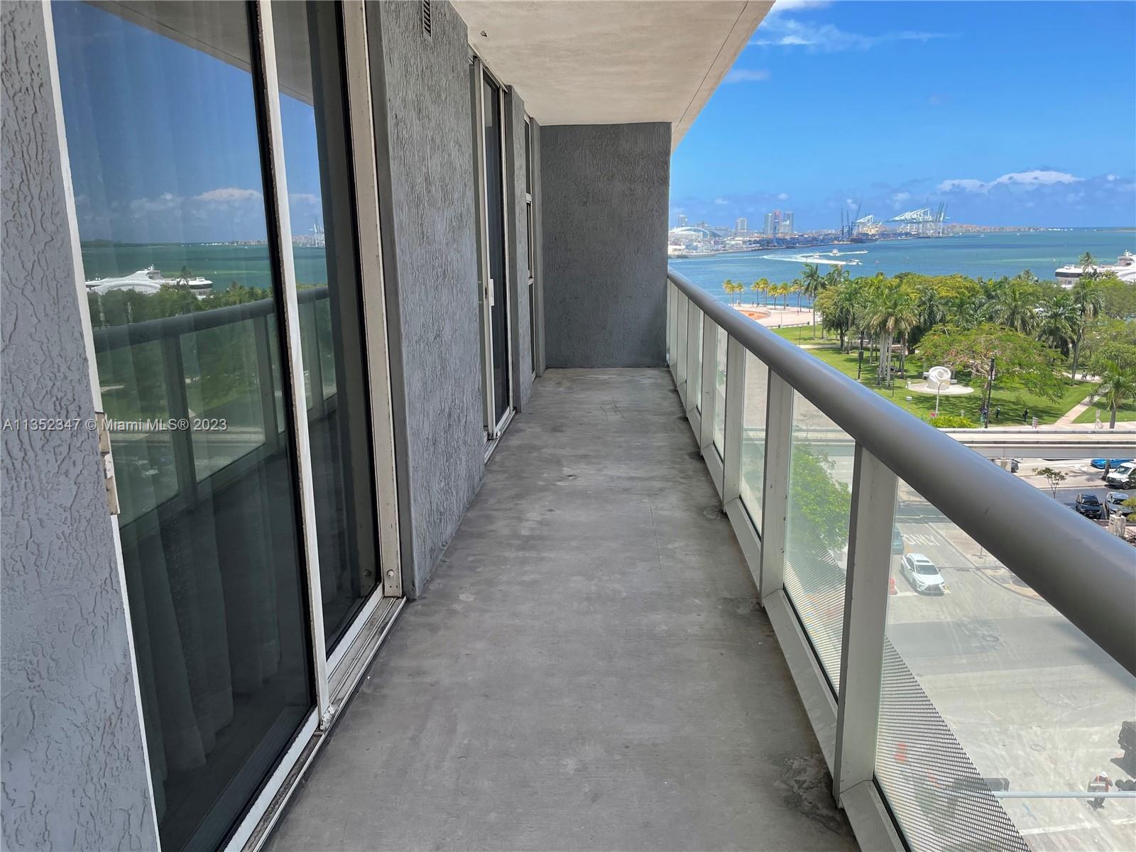 CLICK VIRTUAL TOUR LINK TO SEE VIDEO. Modern corporate style partially furnished bay view unit at 50 Biscayne, all tiled, Designer furniture by Rockwell Group, direct bayfront park bay view from balcony and very spacious closets, split floorplan, freshly painted. 50 Biscayne building is full of 5 star amenities including a state of the art gym w a view, resort style pool w cabanas, spa with steam room and sauna, party room, and more. Excellent central location right across Biscayne park near Bayside, American Airlines Arena, Whole Foods, Silverspot Cinema, people mover stop, govn't station, Brightline Station, & Brickell City Centre. Rent includes 1 parking, water, cable, internet. Short term possible with higher rent.*Yellow sofa & chairs in living room pix are no longer included in unit*