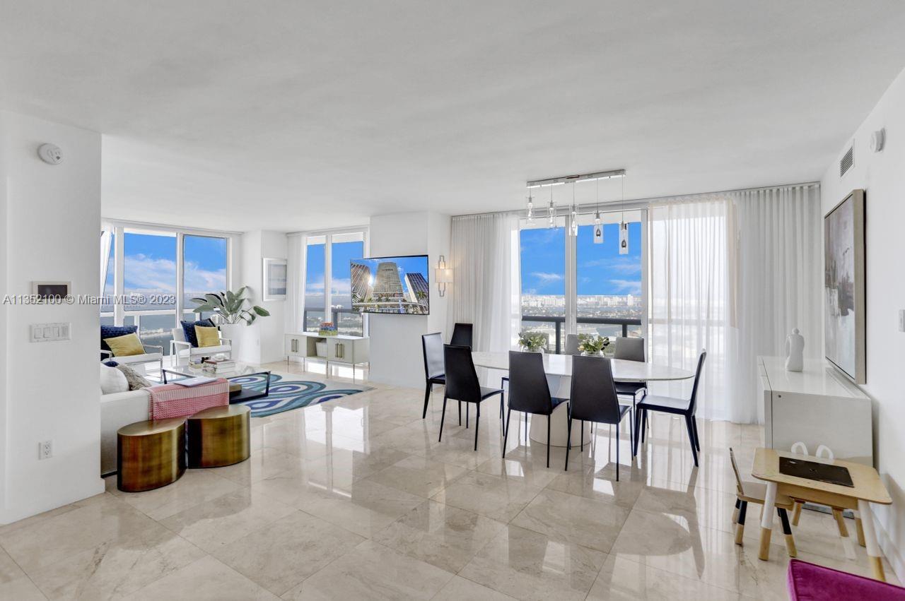 Endless breathtaking northeast view from the 49th floor overlooking Biscayne Bay & points beyond.  Light & bright, this rarely available 3-bedroom 2 bath dwelling in the sky allows you to relax peacefully while being in awe of the mesmerizing unobstructed vistas.  Apartment 4902 features marble floors in the main areas with wood floors in the bedrooms, separate laundry room & enormous wraparound balconies on the entire east & north sides.  Being on the NE corner, one overlooks the ports, the museums, the arena plus walkable to top restaurants, Whole Foods, Cinemas ++.  50 Biscayne is located directly across from Bayfront Park with amenities including 24/7 security & concierge, valet parking, state of the art fitness center, infinity pool & jacuzzi with poolside cabanas, spa & sauna & more.