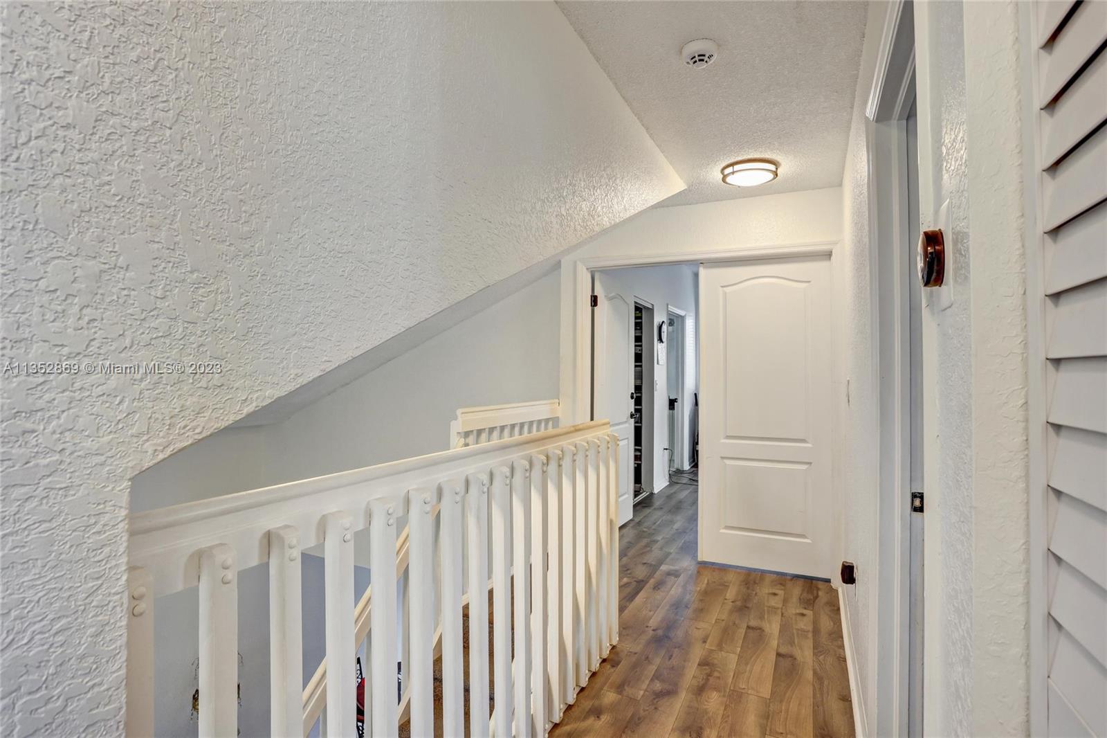 Hallway between bedrooms. Laminate Floor