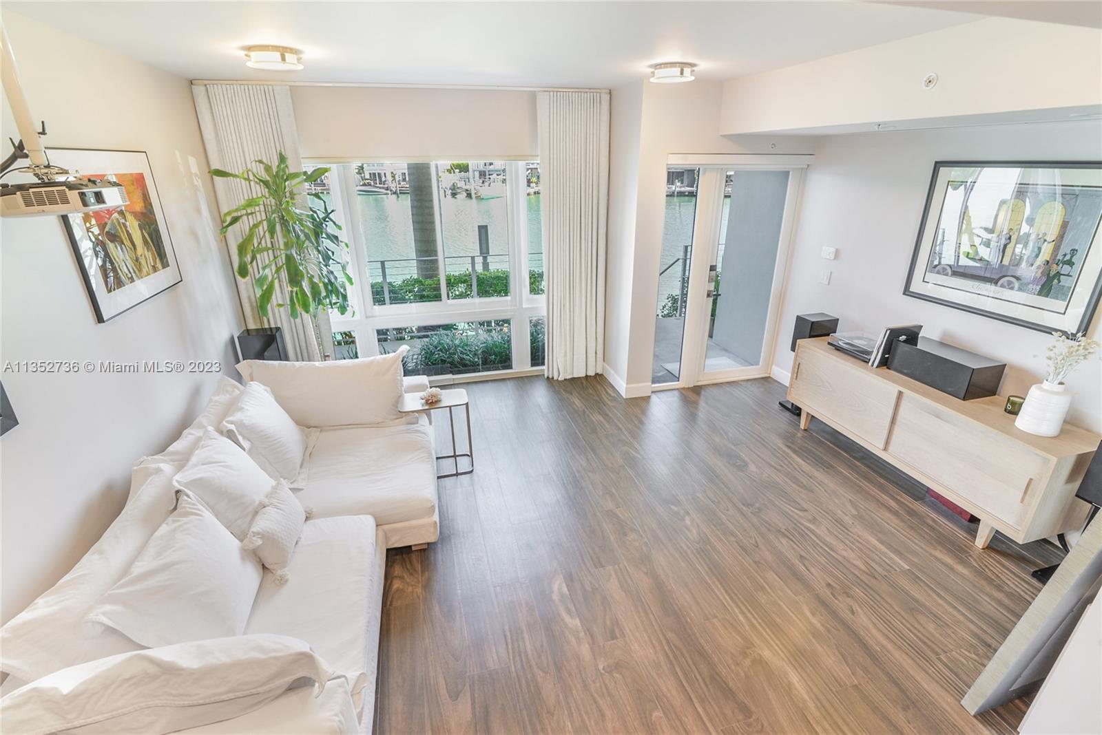 Modern luxury waterfront townhome offering a $300k Boat Dock and new boat lift included in the price. Exclusive Iris On The Bay, 4 bed/4.5bath home on wide water, features high-end upgrades, easy ocean access, private elevator and multi car garage. Beautiful water views are on display from every floor. Enjoy your private rooftop terrace with summer Kitchen, expansive ocean and intracoastal views. Entry room lounge features a cinema/entertainment system with surround sound. Townhome upgrades include, EV fast charger, Savant Smart Home system, DICA Kitchen, Miele appliances, designer lighting, California Closets, tinted windows, hardwired internet on every floor, and water purification throughout. Normandy Shores boasts a golf course, clubhouse dining, tennis, pickle ball, gym & playground.