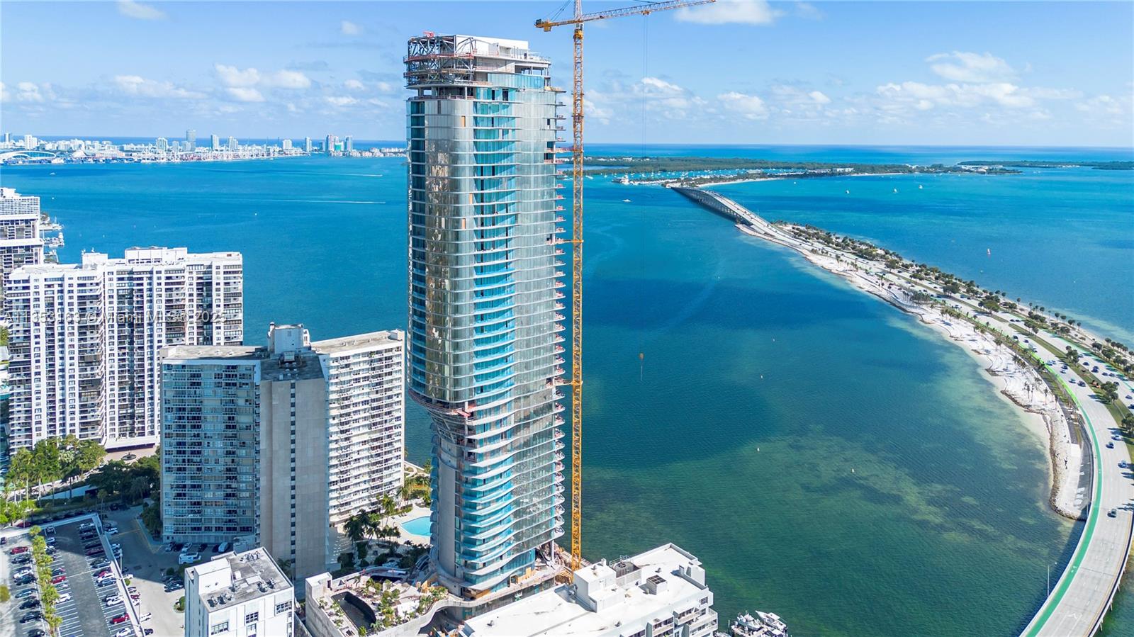 Una’s 135 luxury residences set the standard for Brickell waterfront living with visionary design, inviting gardens and unrivaled views across Biscayne Bay. The 47 story iconic tower is recognizable by the smooth, light metallic surface and striking silhouette that recalls the shape of a wave. 2-5 bedroom residences feature 11 ft floor to ceiling glass and expansive terraces as well as an array of amenities including three pools, a spa and gym elegantly envisioned by the chairman of Aman. With easy access to Coconut Grove, Downtown, Brickell, MIA and the beaches of Key Biscayne, Una is exemplar for Miami living.