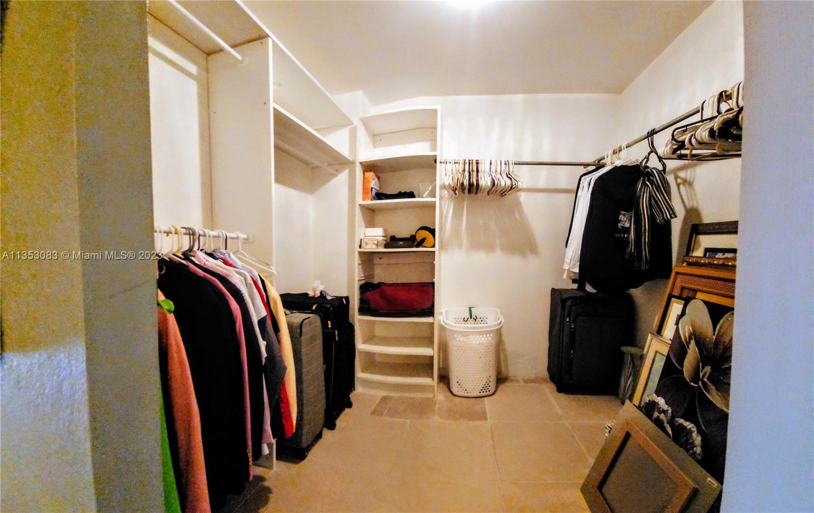 Primary bedroom walk-in closet