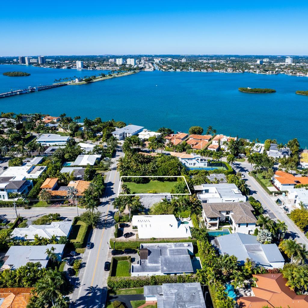 Build your dream home on a 10,000 sf square-foot lot in one of the most desirable neighborhoods in South Florida: Bay Harbor Islands. Included is a full set of plans designed by SDH studio. Total area 6,710 SF. Total under air 5,996 SF.