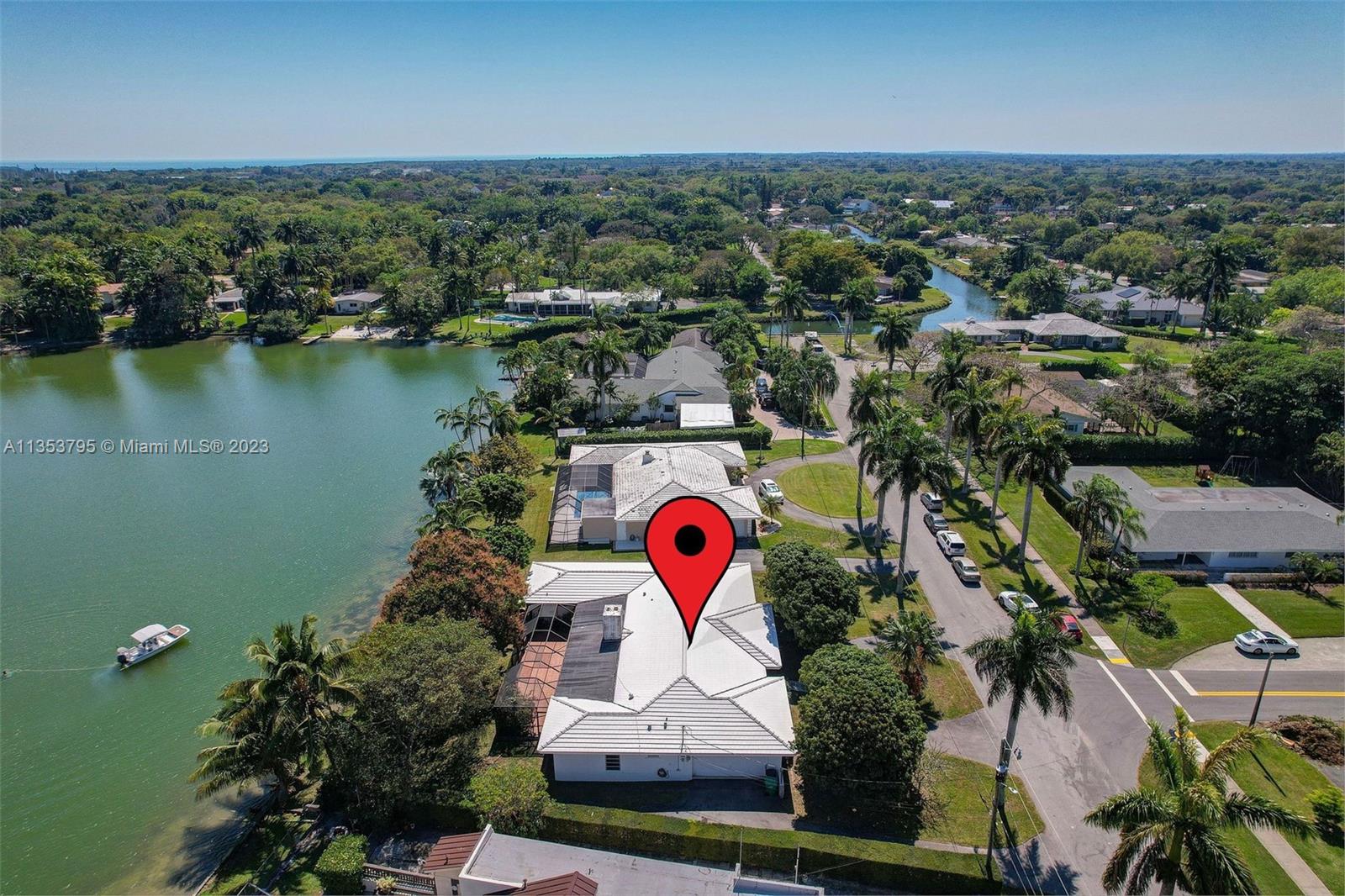 Stunning water views at this spacious lakefront home, just south of 136 ST on the quieter part of 72 AV -Wonderful north Palmetto Bay neighborhood, Palmetto Schools! This is the very first time this home is on the market. The owners' parents picked this specific lot to build, centering the Tanglewood lake. There's a huge patio with plenty of room to add a pool. This home has many possibilities for your remodel, with spacious bathrooms and extra closets, there are options to open and expand. See floor plans at the end of the photos. There are 4 bedrooms stacked, w/ the 5th bedroom / 3rd bathroom on opposite side, great for guests, in-laws, or a home office.  Formal dining room, large kitchen remodeled "after Andrew" is open to the family room and adjacent to the patio. Selling AS-IS.