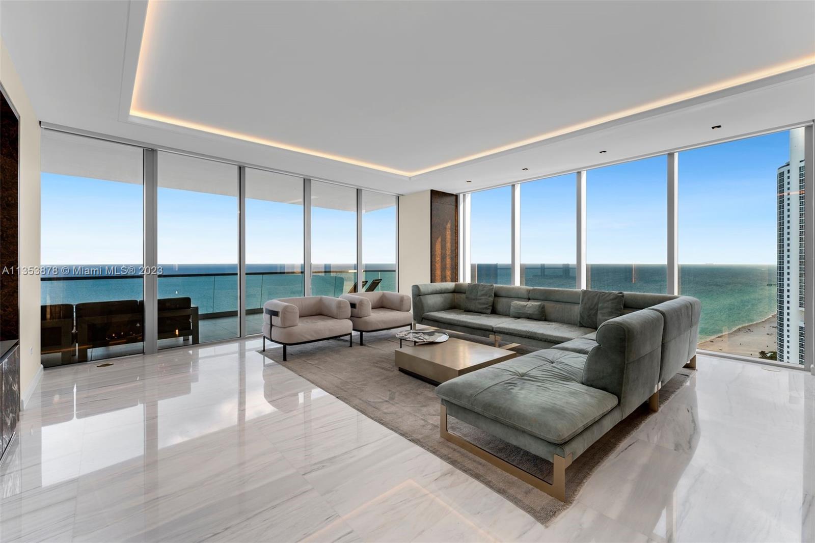 This luxurious, one-of-a-kind 4 bedroom, 4+1 half bathroom home in the sky at the coveted Turnberry Ocean Club offers SE exposure providing stunning, unobstructed 180-degree views of the ocean & bay. Features include Italian custom design with Carrara marble floors, Stradivarius hardwood in bedrooms, smart home tech, atmospheric lighting, custom millwork and a large oceanfront terrace with summer kitchen. The unit is furnished with high-end brand names Ruggiano, Baxter, & Vissionaire. Gourmet kitchen with Italian cabinetry, stone counter & Gaggenau appliances. Turnberry Ocean Club offers 70,000 sq ft of luxury amenities including 3-story private signature Sky Club with sunrise/sunset pools, private dining, health & wellness spa, & beach service. Enjoy the ultimate luxury living experience.