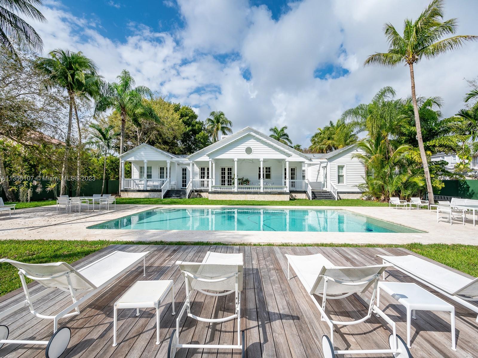Welcome to this stunning Key West style estate, situated on a sprawling one-acre street to street lot in the desirable Ponce Davis neighborhood. This 7,174 SF Total single-story home boasts 7 bedrooms, 8.5 baths & a 3-car garage. As you enter you'll be greeted by an open floor plan that seamlessly blends the living, dining & family rooms. The gourmet kitchen is complete with top-of-the-line appliances, custom cabinetry & large center island. The primary suite offers a spa-like bathroom & walk in closet. Each of the 4 bedrooms have their own en-suite baths. With an additional service room and office with full bath. The outdoor area is an entertainer's paradise, featuring a covered terrace, and a stunning pool with a cabana bath.