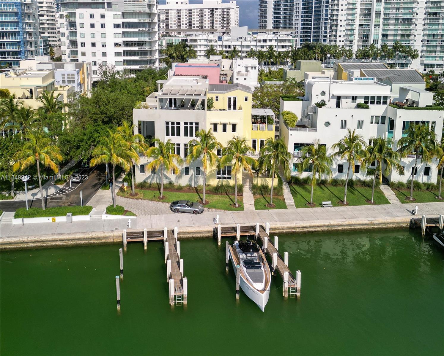 This amazing 4 story waterfront home is being offered with all the amenities you could wish for!   Water views and expansive terraces at every level to enjoy mesmerizing sunsets and or your atrium garden center. This 5,298 SF re-designed home offers 5 bedrooms and 5 en-suite bathrooms,  Poggenpohl kitchen with gas range any chef would love, designer soffits with cove lighting and custom made Italian millwork throughout. New electrical, plumbing, and elevator. No expense spared.  The expansive beautiful master suite occupies entire 3rd floor for peaceful secluded living.    Set out in Miami from your oversized air conditioned private garage or by sea from your private deeded dock in the front of your new home . Sunny Florida awaits!