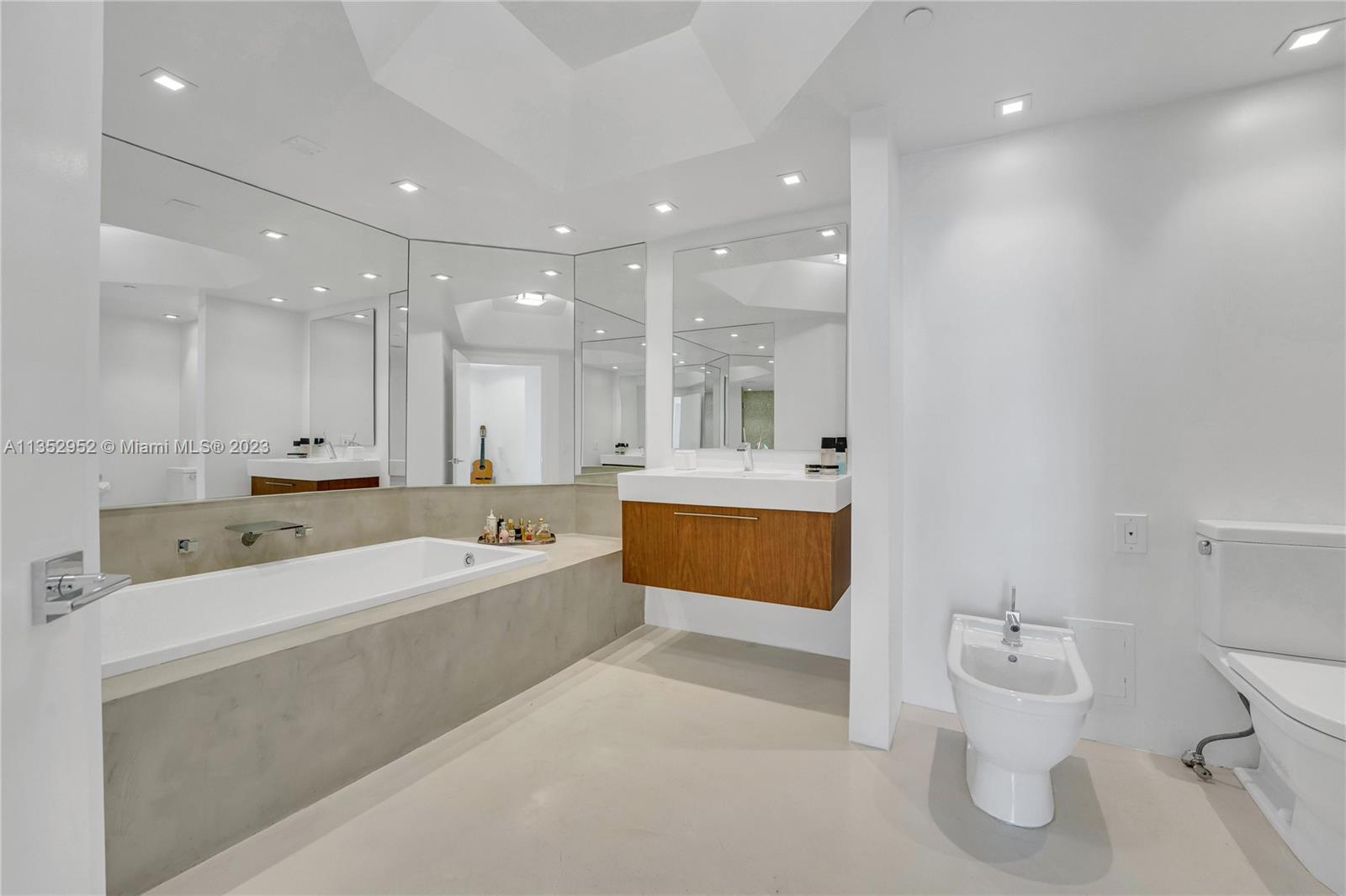 Primary bathroom with glass shower and jacuzzi tub