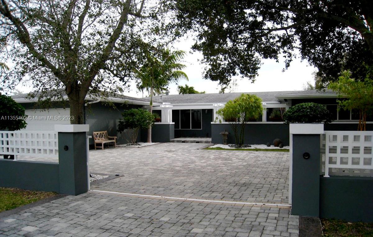 Walk to Pinecrest Elementary! Beautiful modern family home on a quiet street. Gated and tastefully landscaped with cascading pond. Great outdoor entertaining bbq area with second kitchen, open pool in a private setting. Hurricane safe with impact windows and full house generator. Brazilian cherry wood floors throughout, top of the line kitchen and bathrooms, plus gym/office/den. Stable and local landlord looking for longterm tenant. No students.