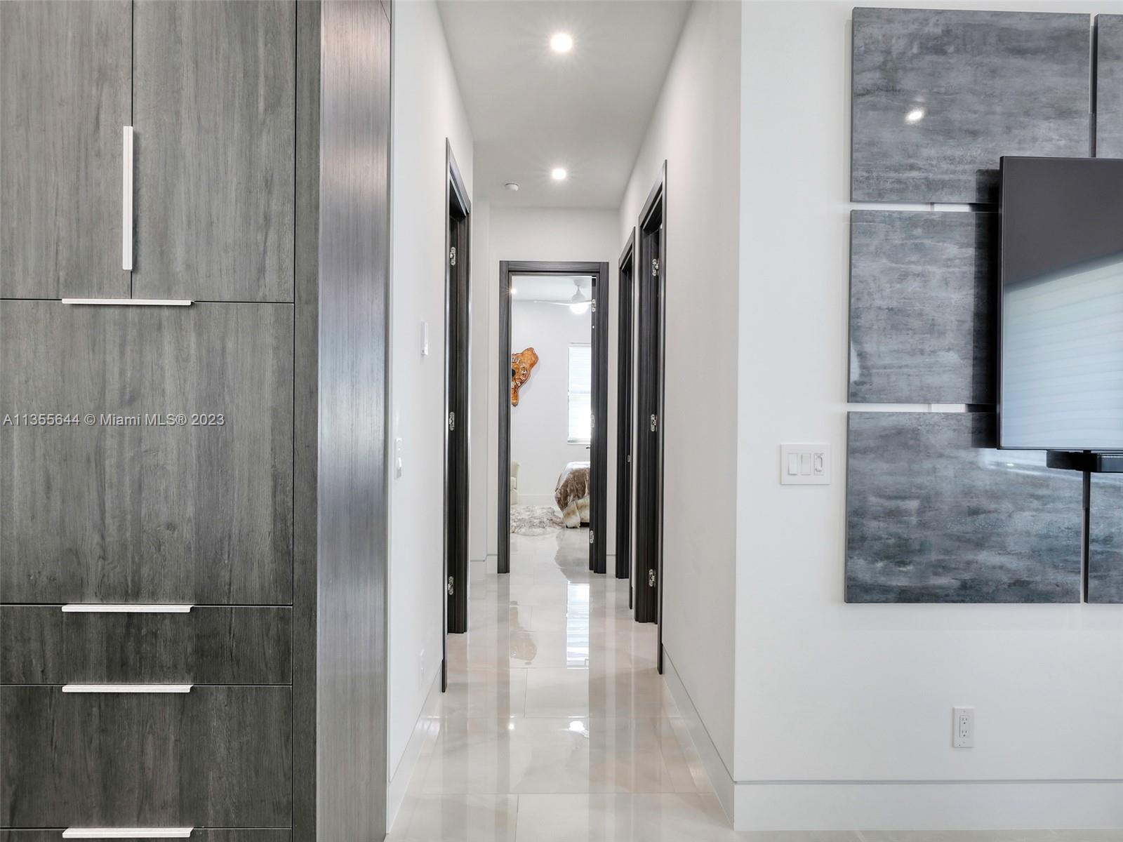 Hallway towards 3 bedrooms, Laundry Room and half Bathroom