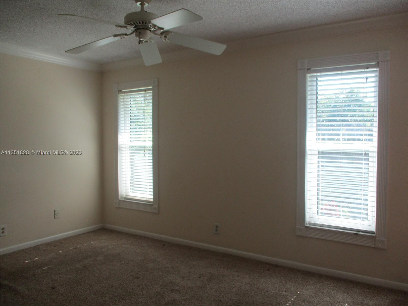 TWO WINDOWS AND FRENCH DOORS INTO THE PATIO TO RIGHT